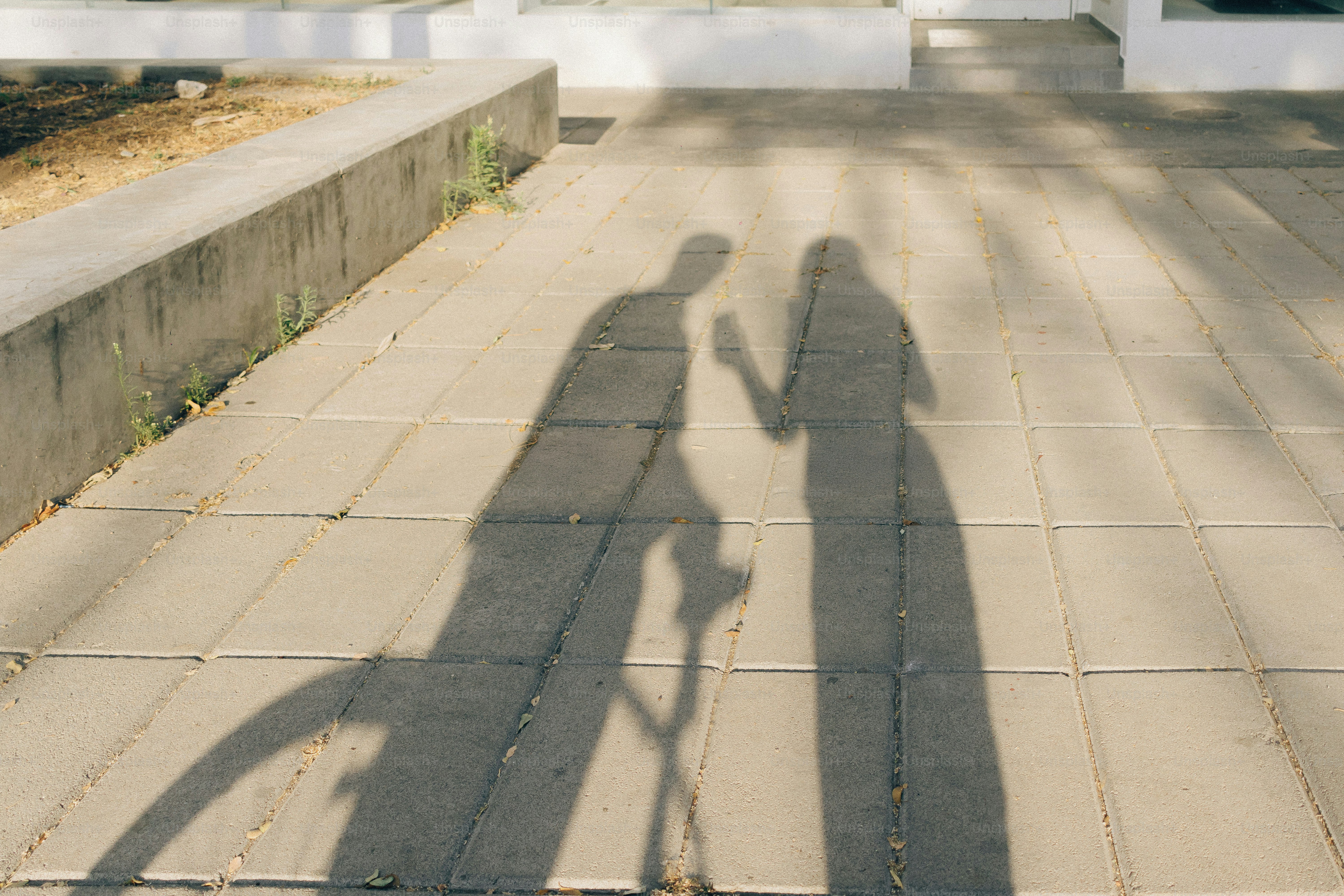 Two shadows of people talking against a wall photo – Abstract Image on ...