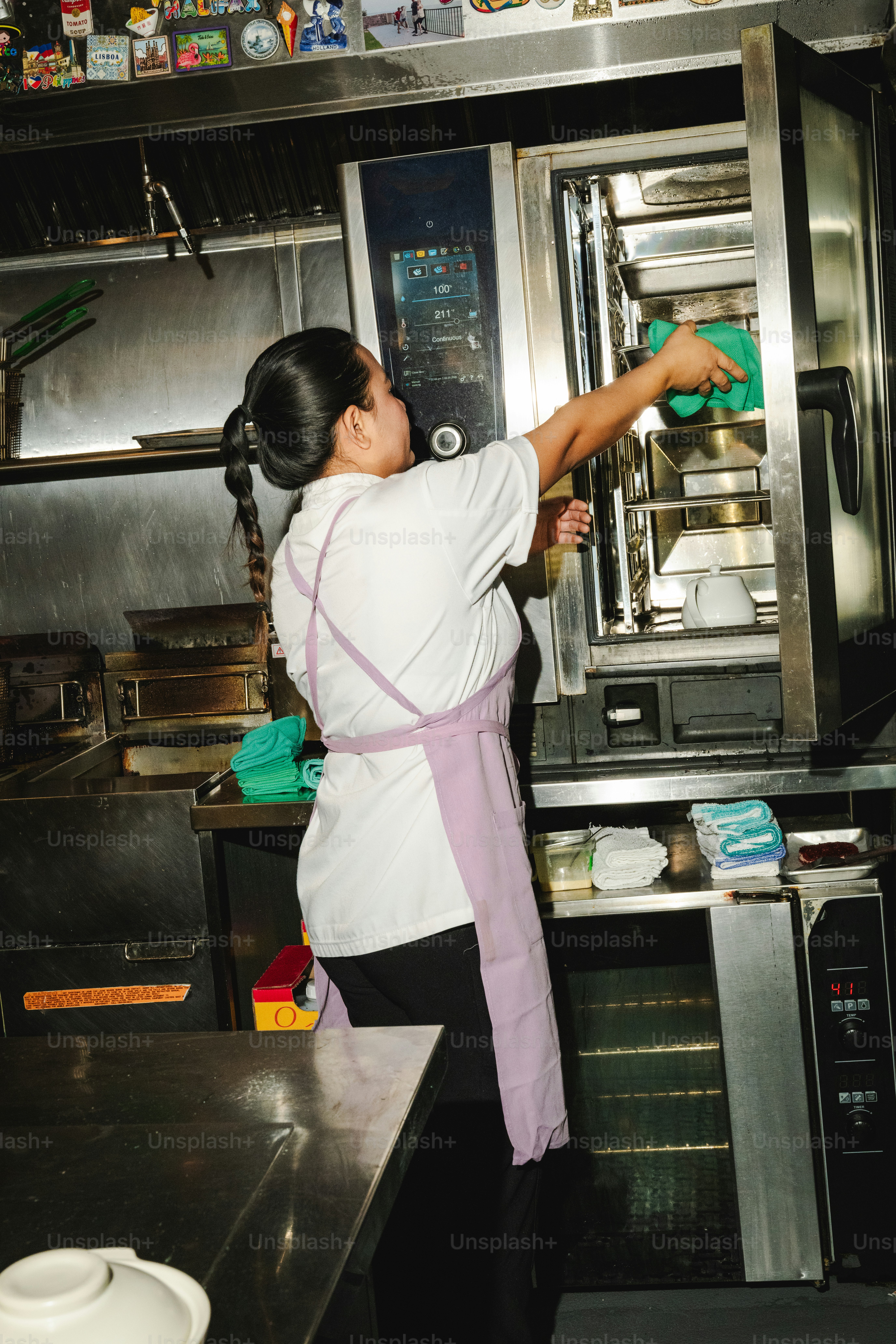 A chef preparing food in a professional kitchen. photo – Restaurant ...