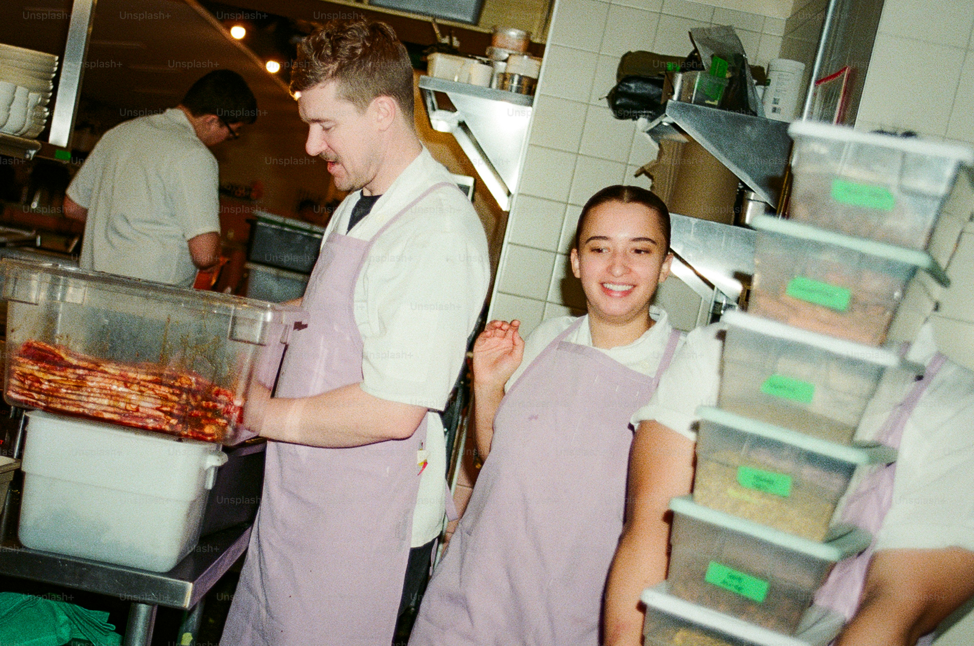 Chefs working in a busy restaurant kitchen