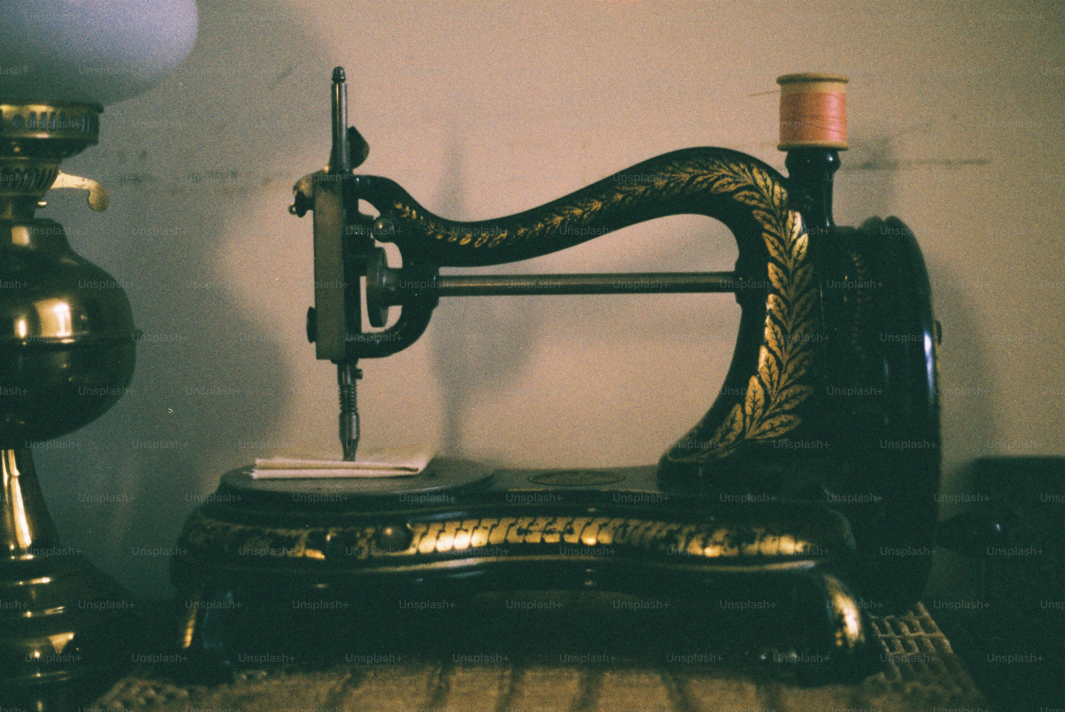 Antique sewing machine with ornate details photo – Home decor Image on ...