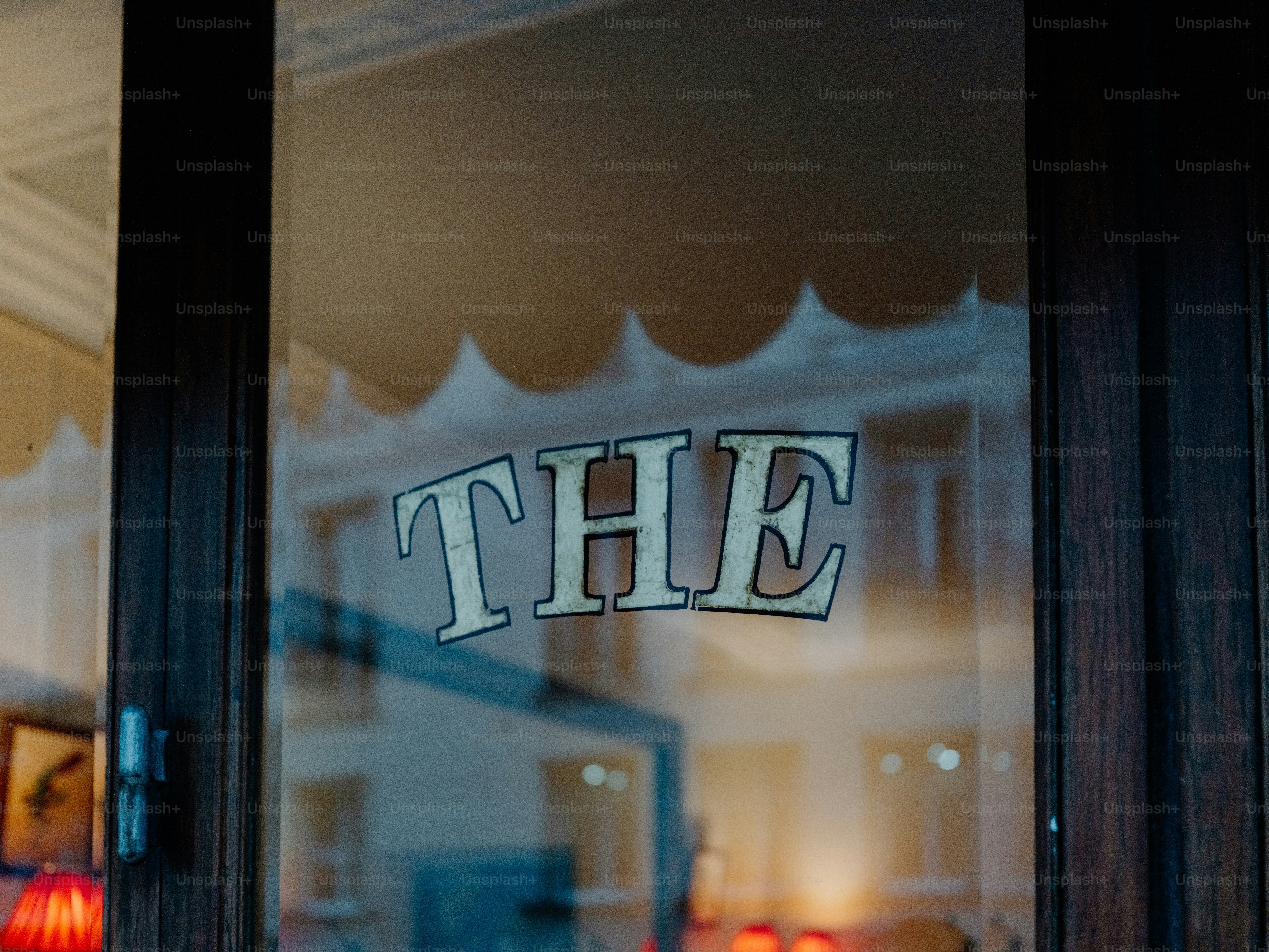 The word the on a glass door
