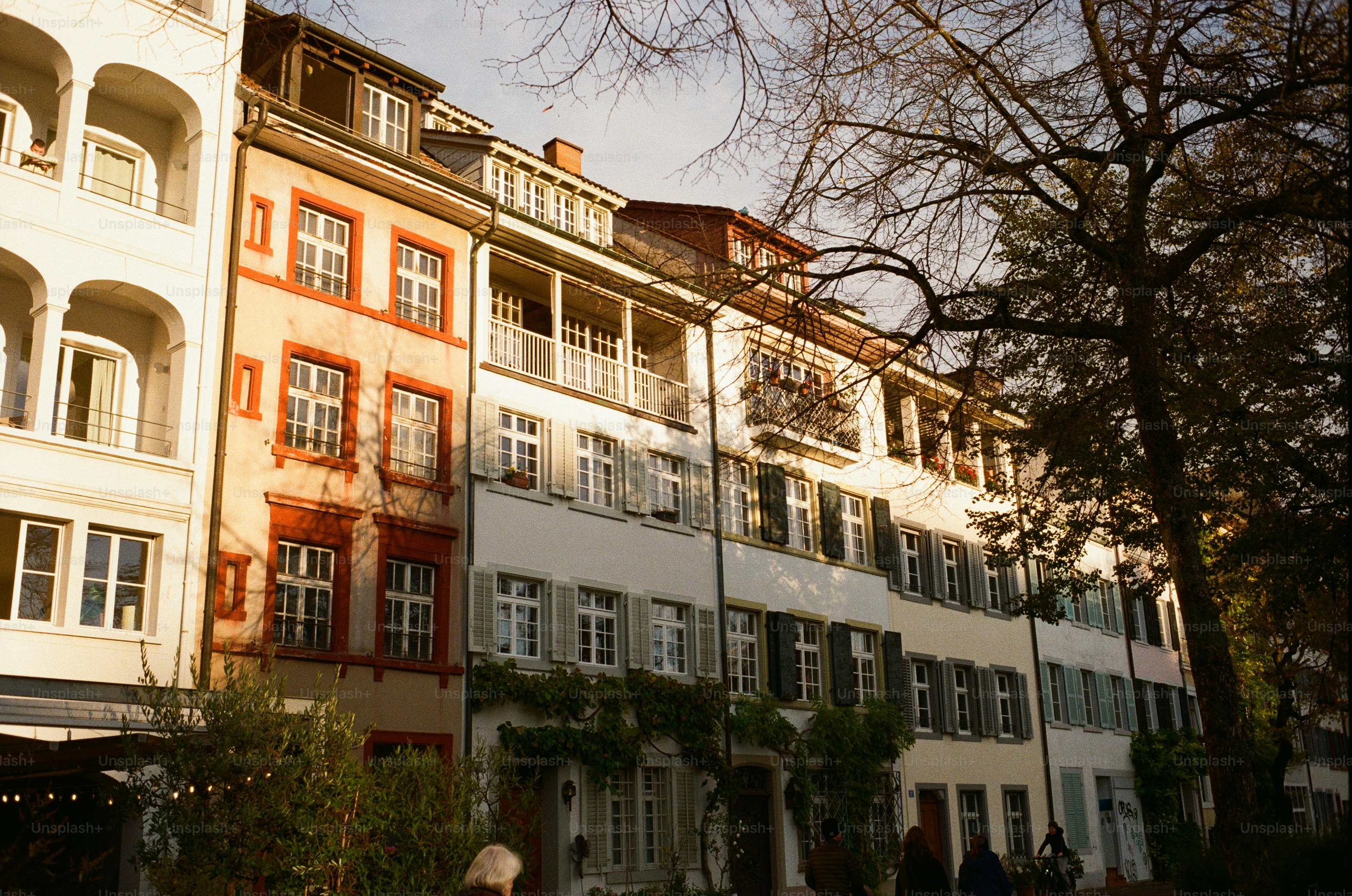 Row of old european buildings with balconies and shutters.