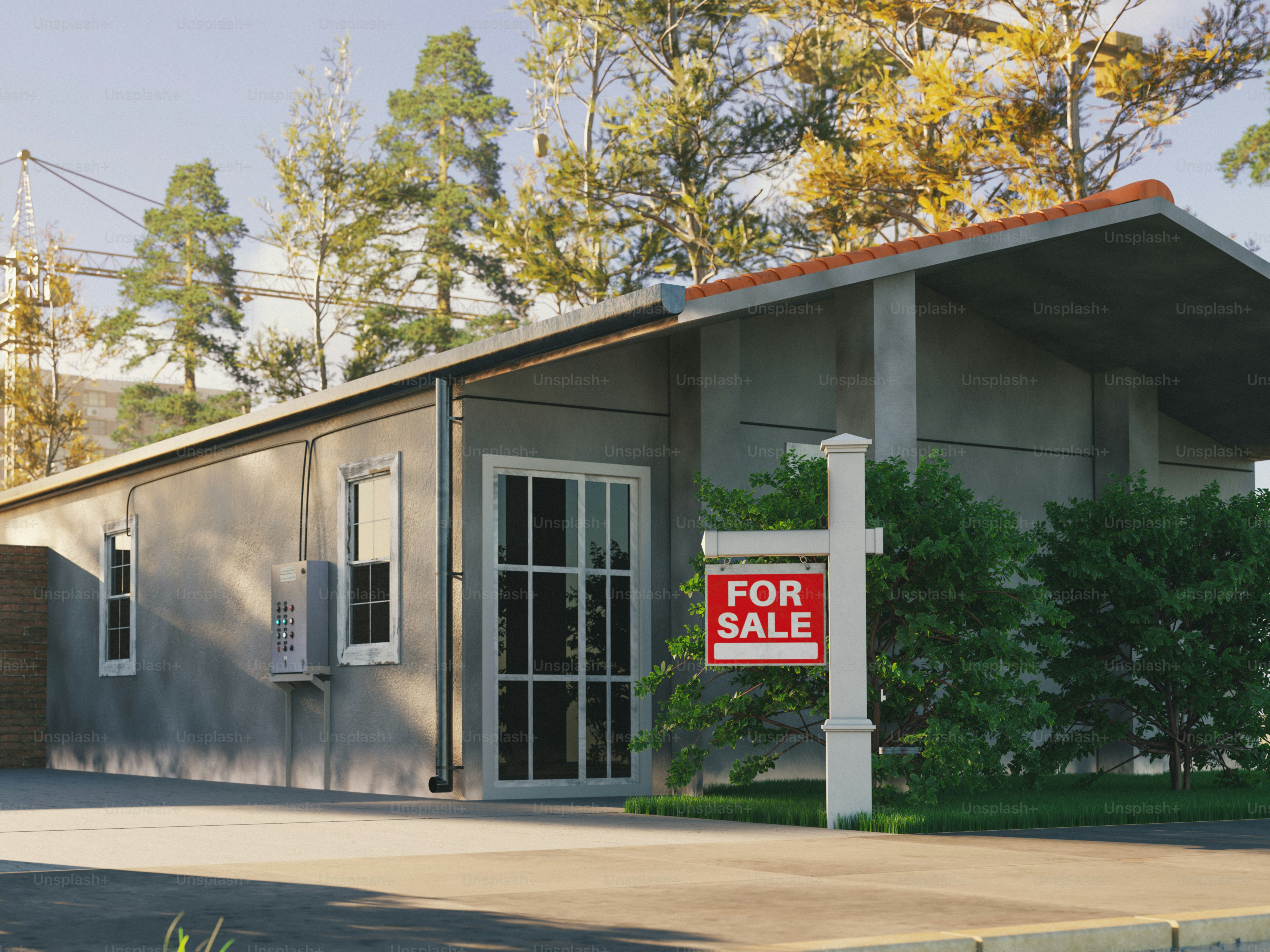 Rumah beton dengan tanda "dijual".