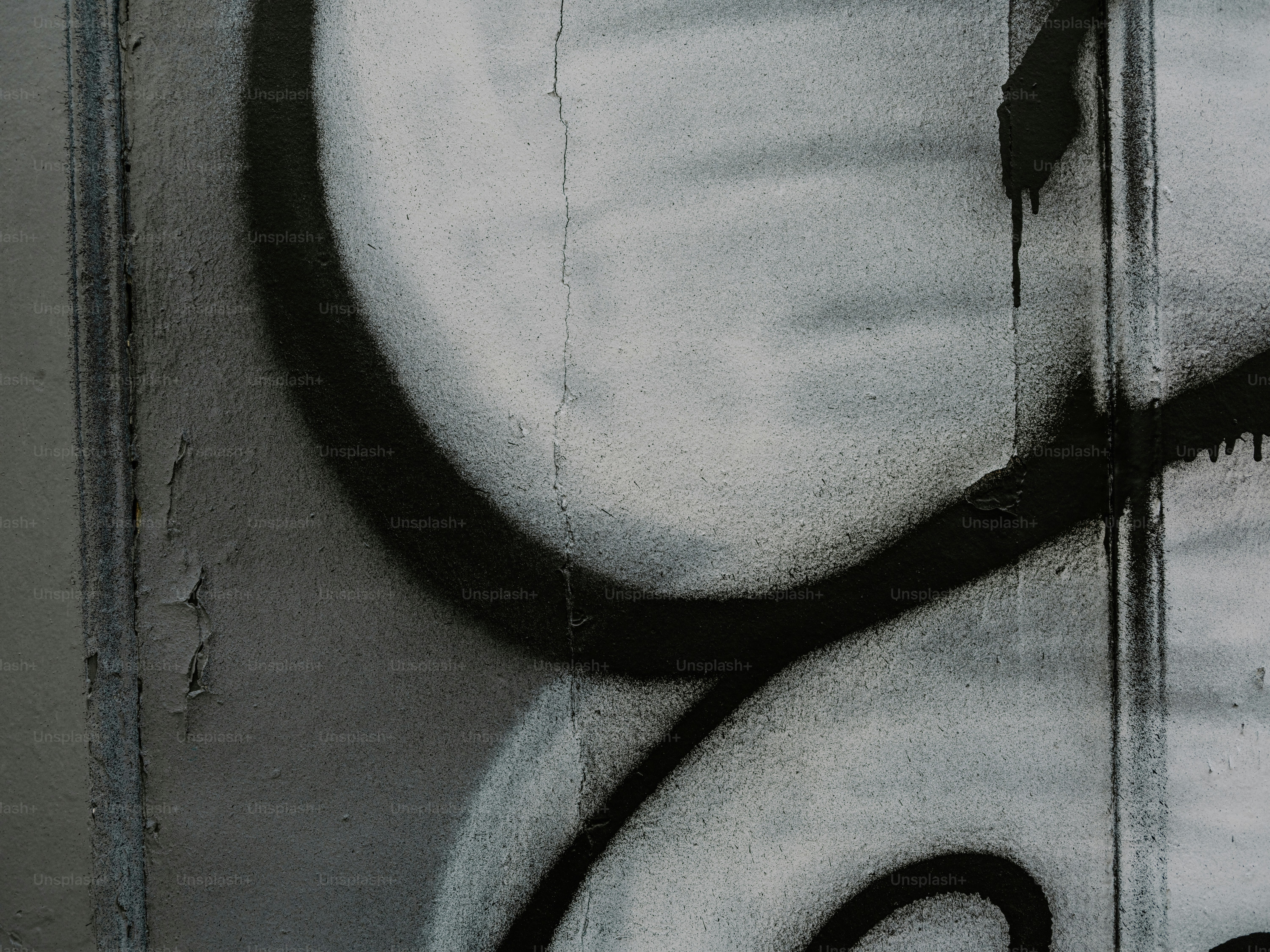 Graffiti art on a textured concrete wall