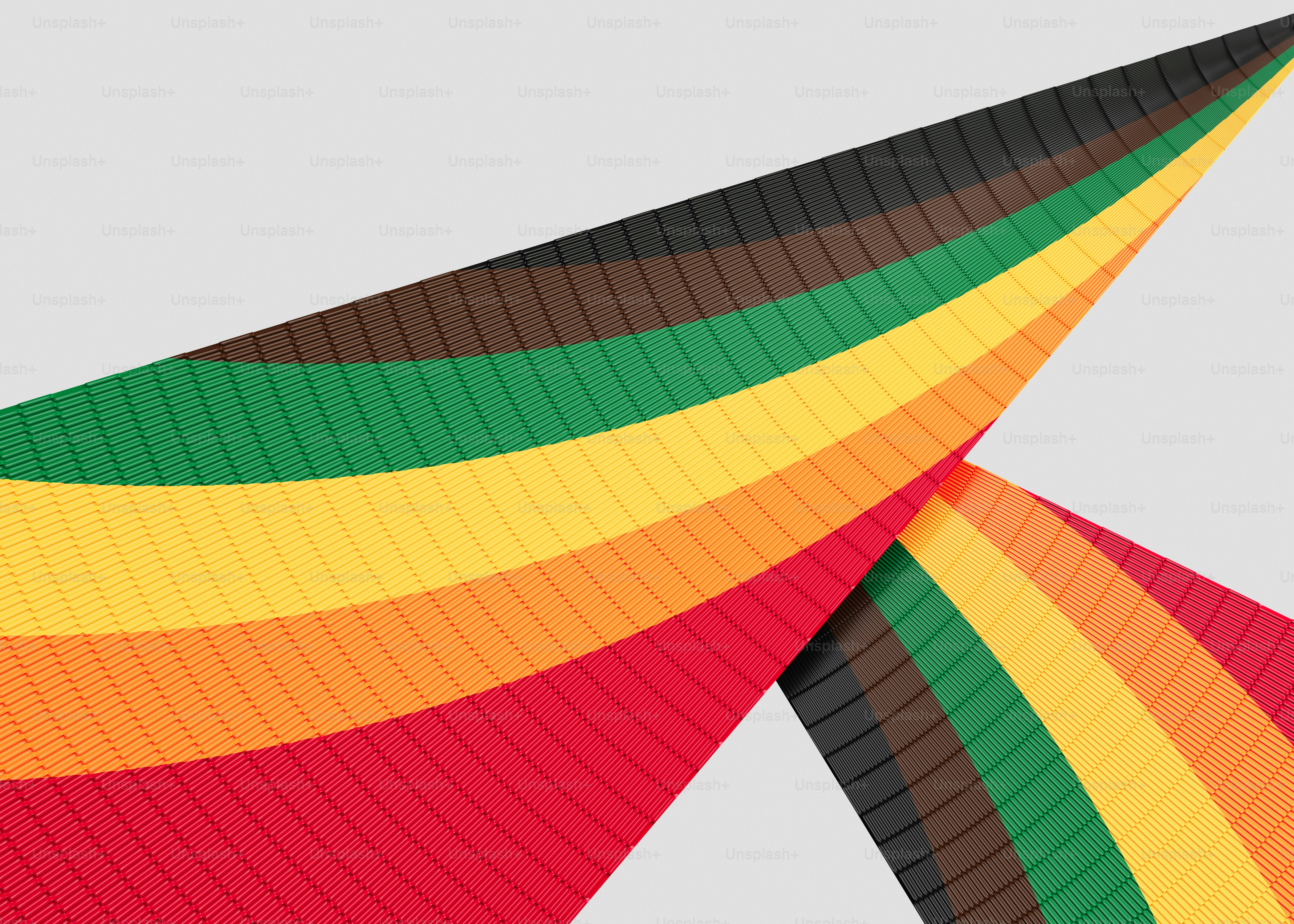 Colorful striped fabric waves against a gray background