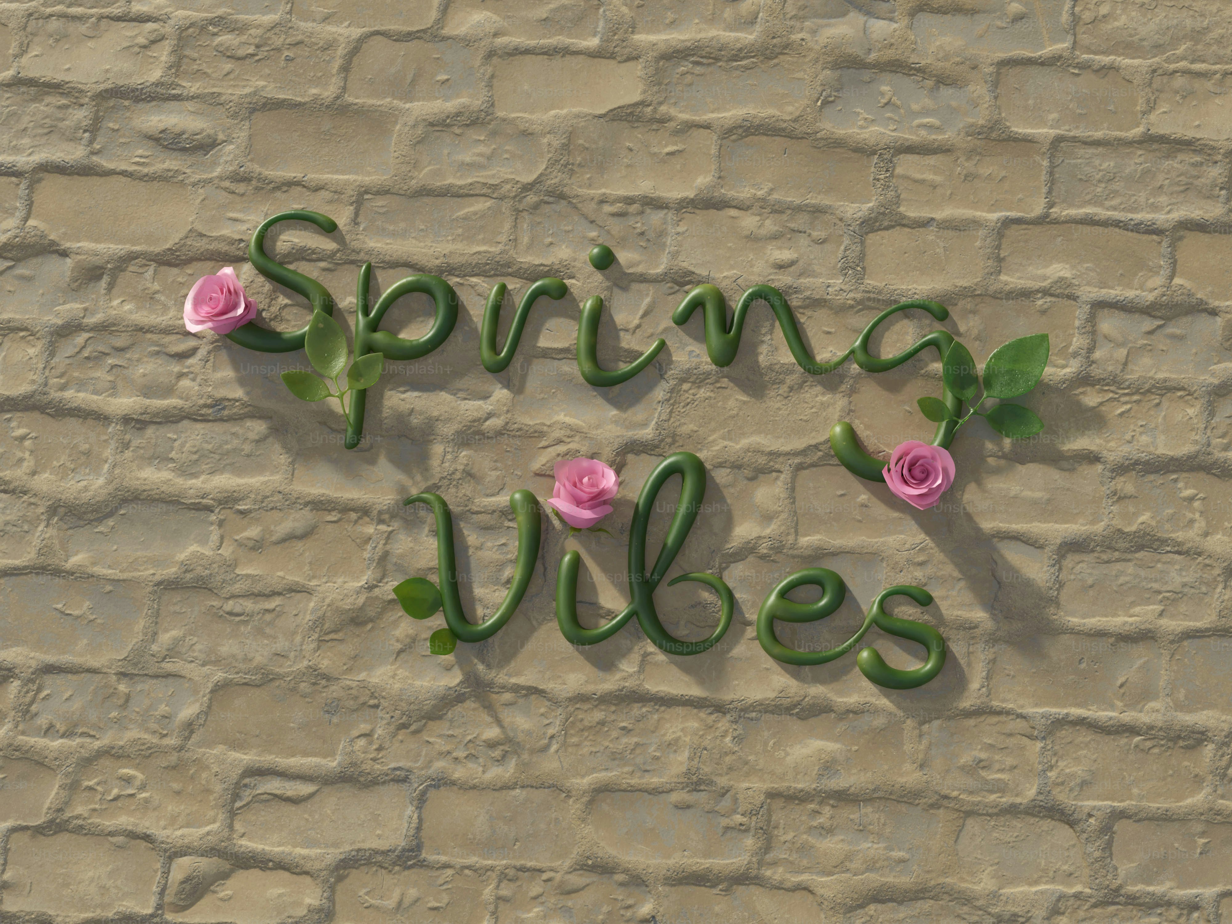 벽돌 벽에 핀 분홍 장미가 있는 봄 분위기