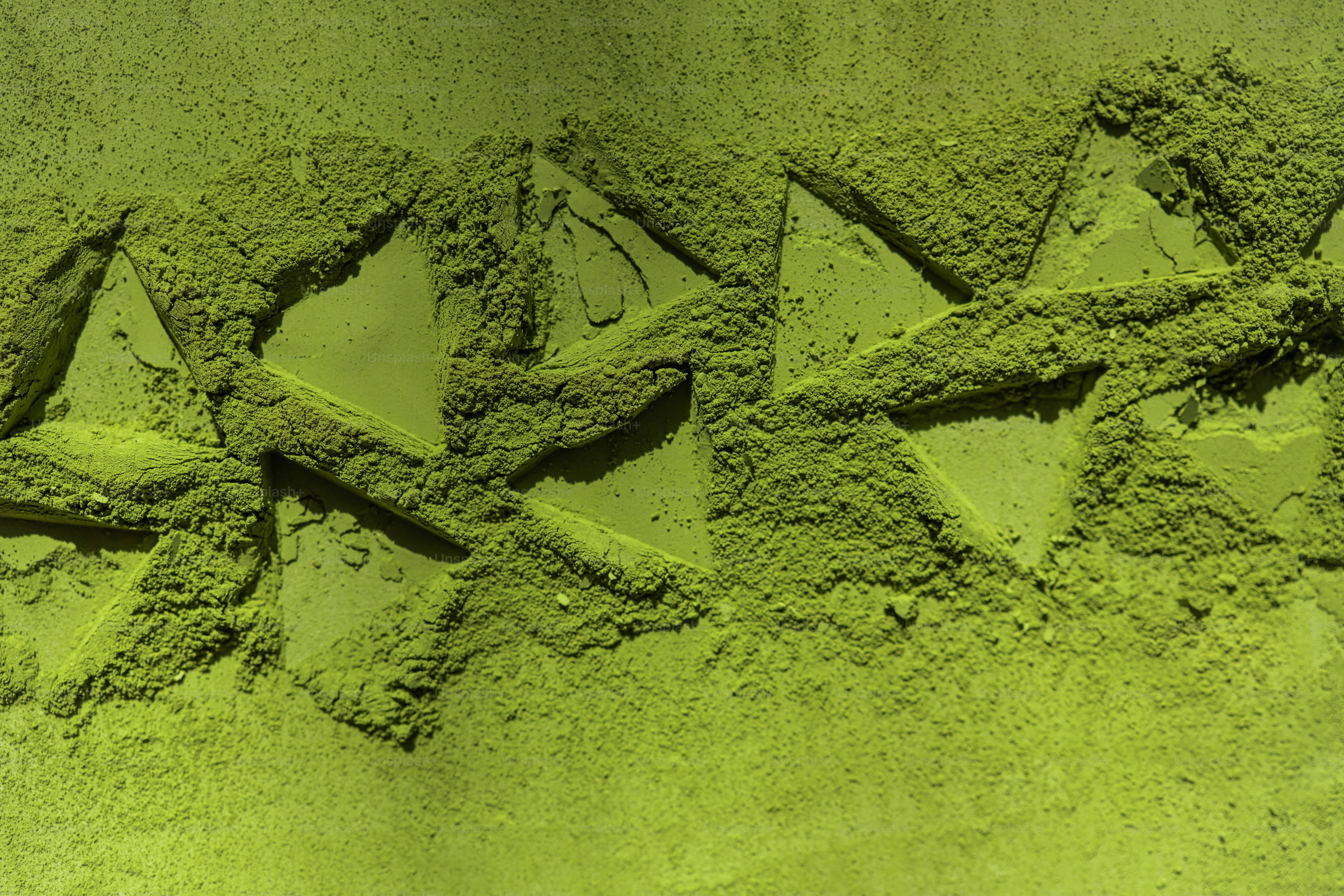 Green powder with triangular indentations in a pattern