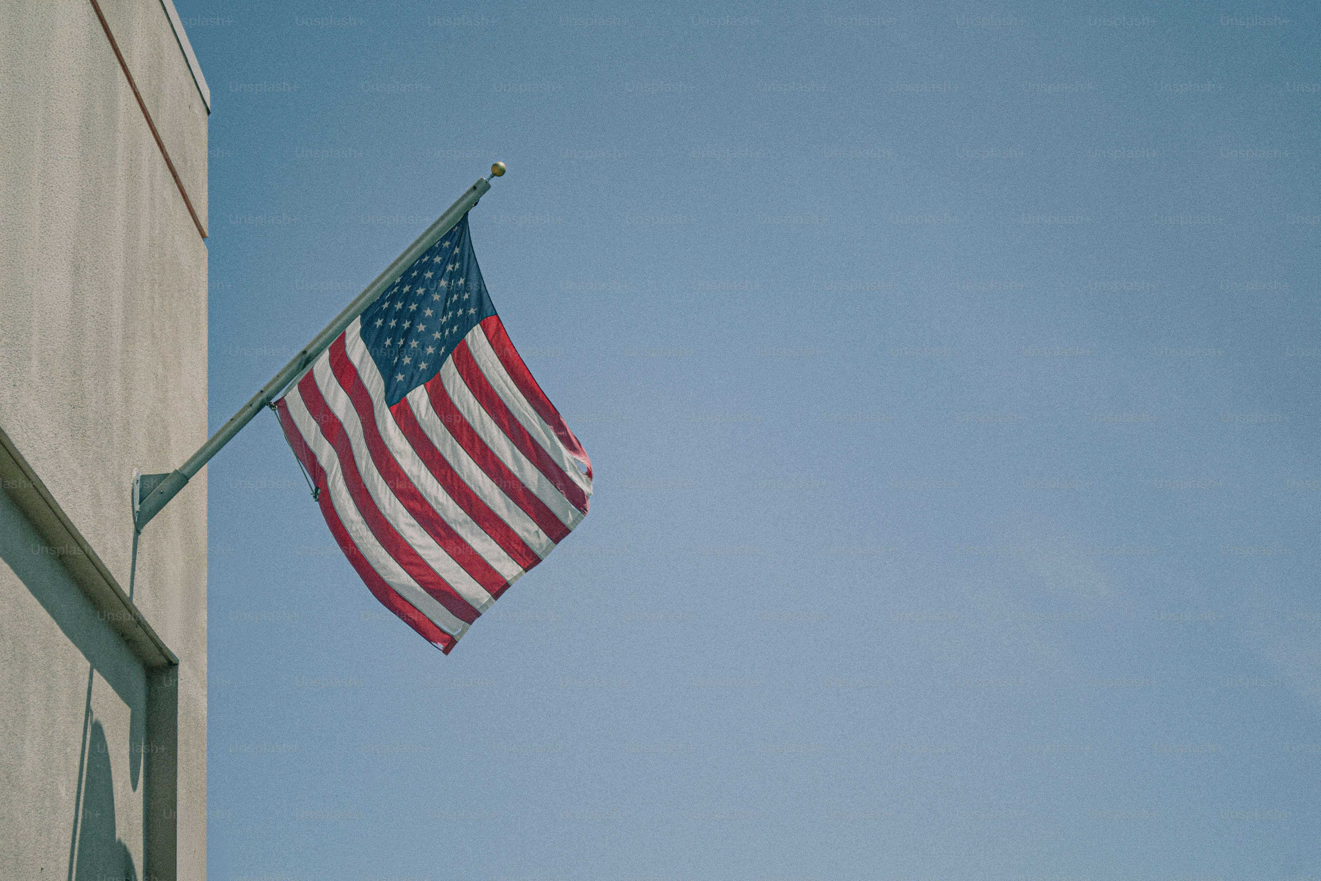 American flag waving against a clear blue sky photo – Usa Image on Unsplash