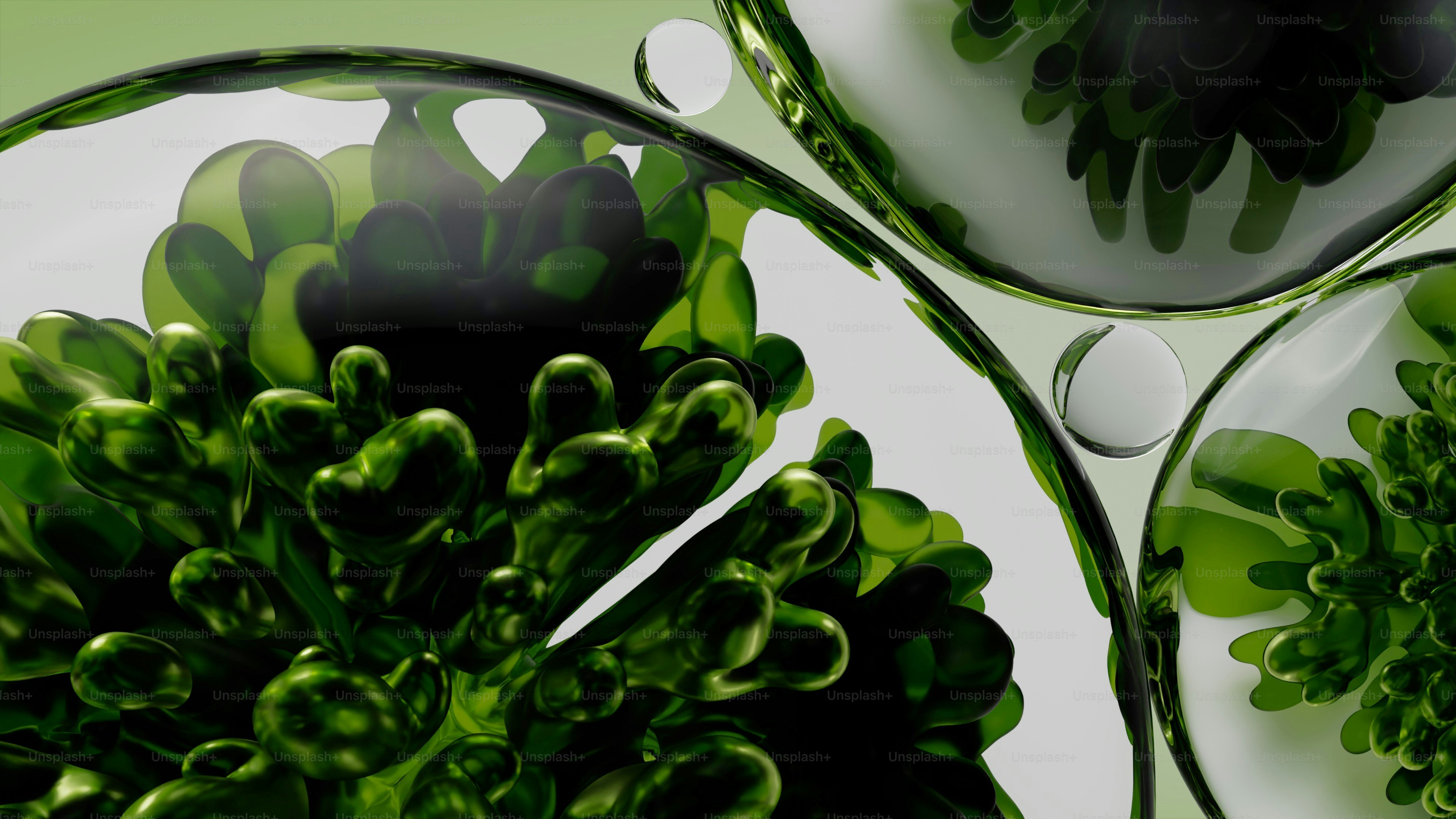 Grüne organische Formen in klaren flüssigen Blasen