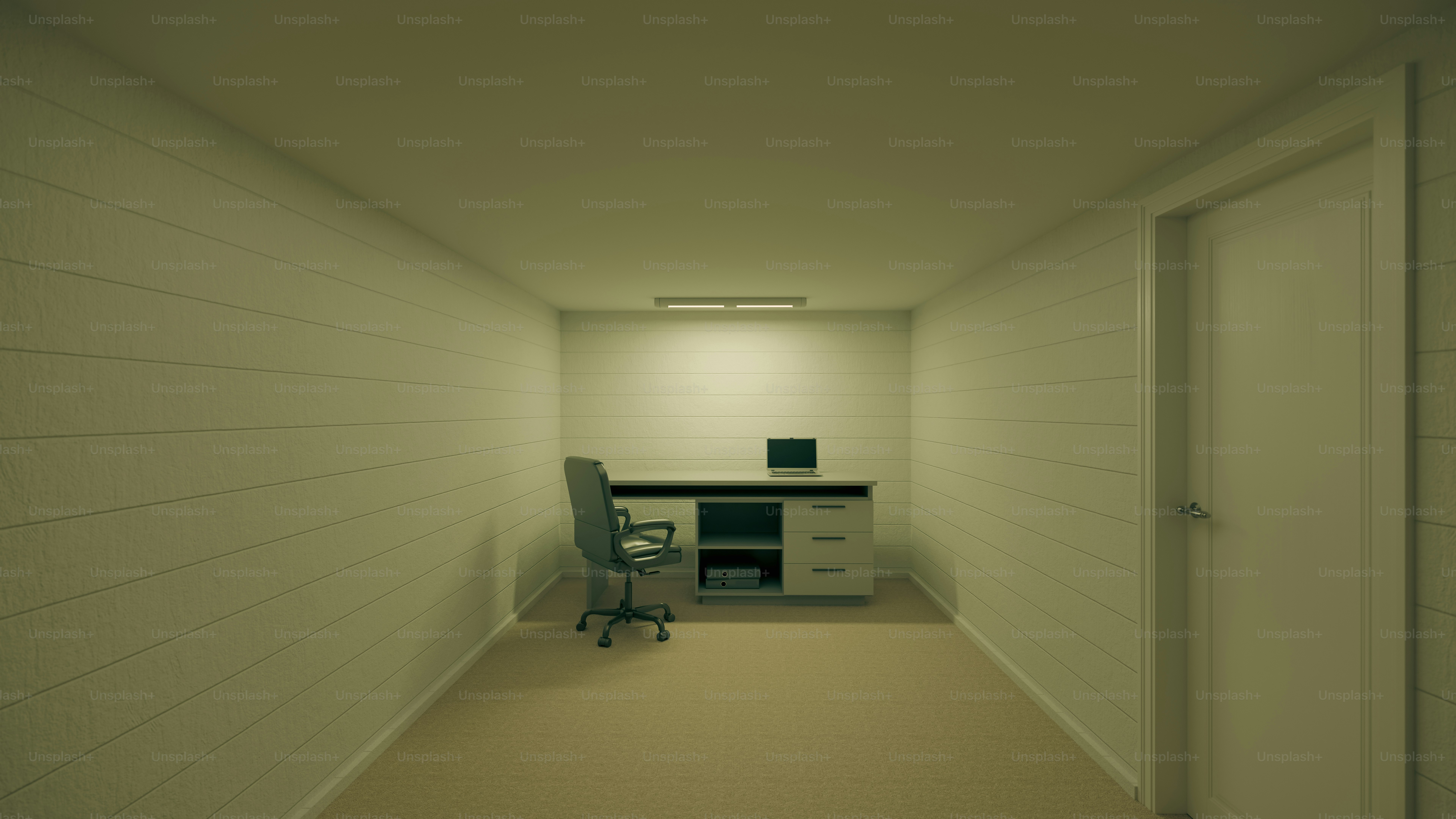 책상, 의자, 노트북이 있는 빈 사무실.