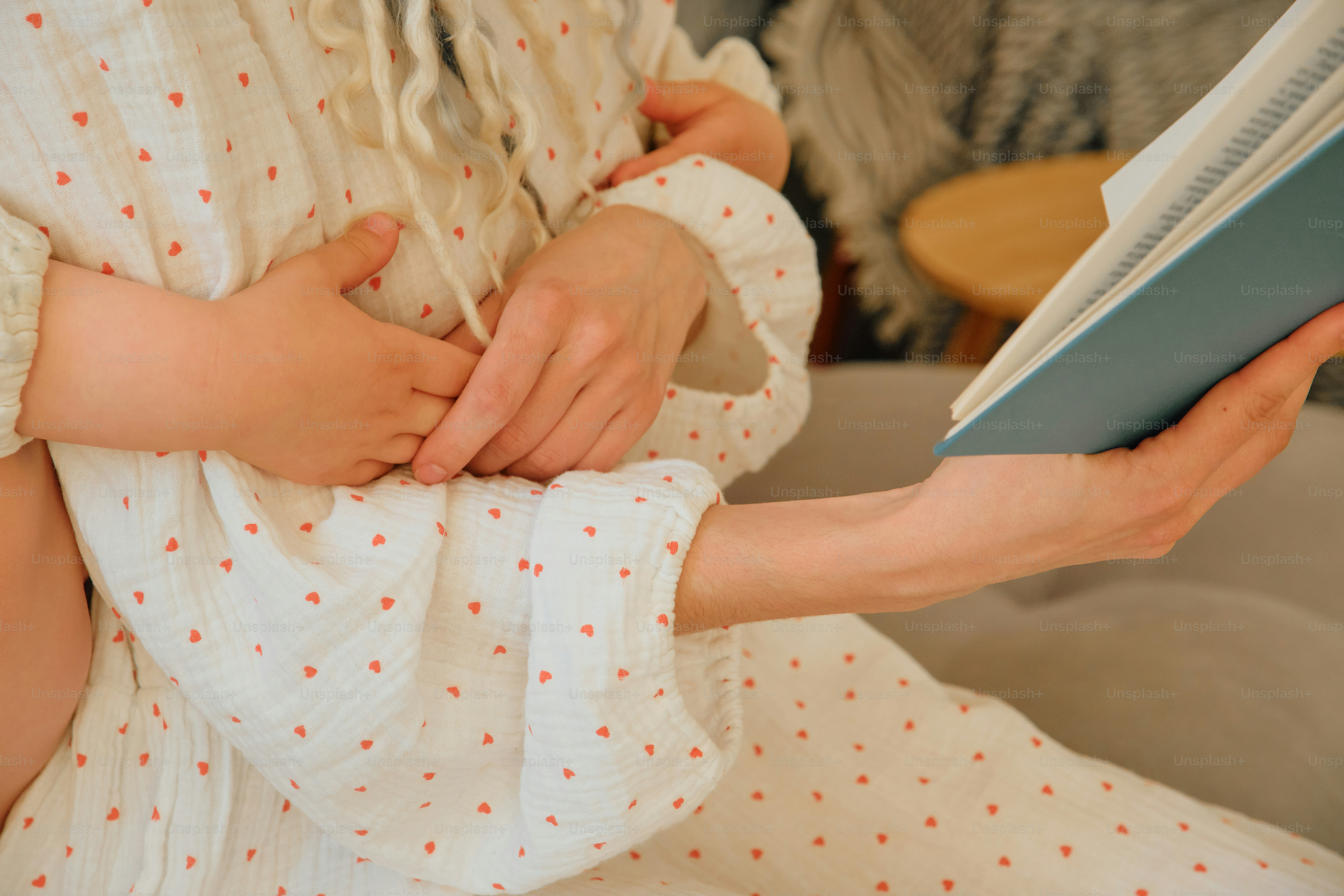 Mother reading a book to her child