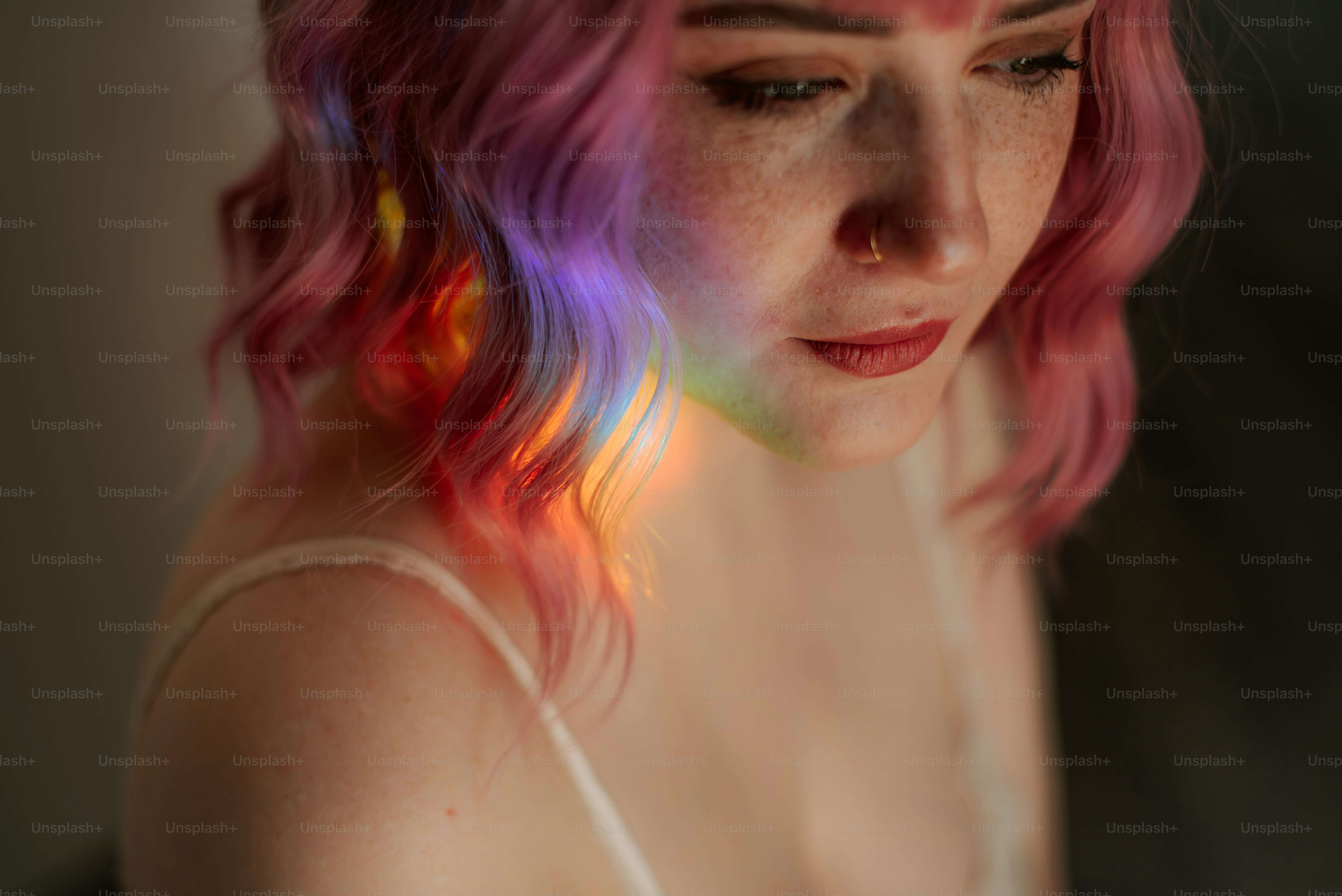 Woman with pink hair and rainbow light on face photo – Portrait Image ...