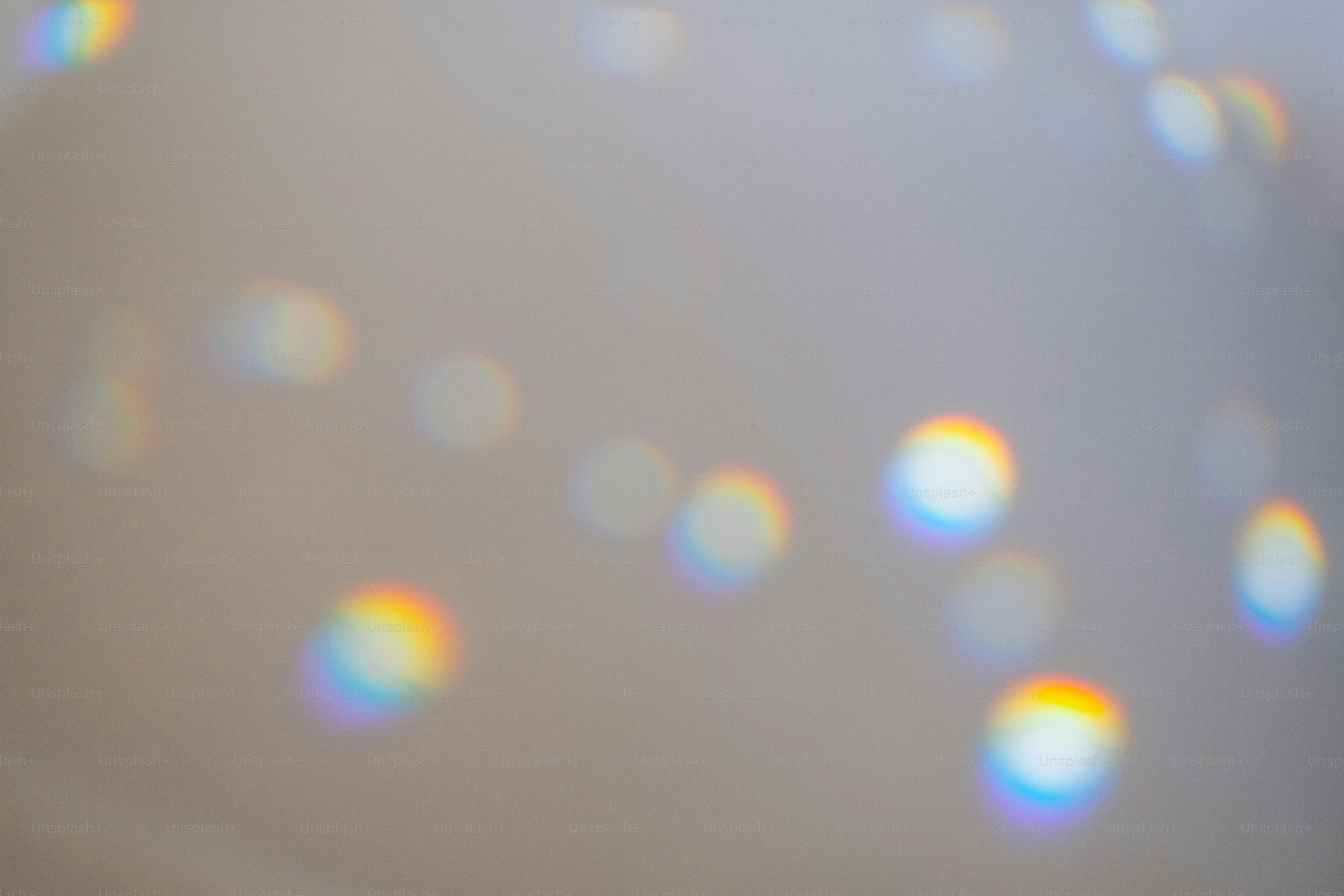 Abstract light refractions with rainbow colors on gray background