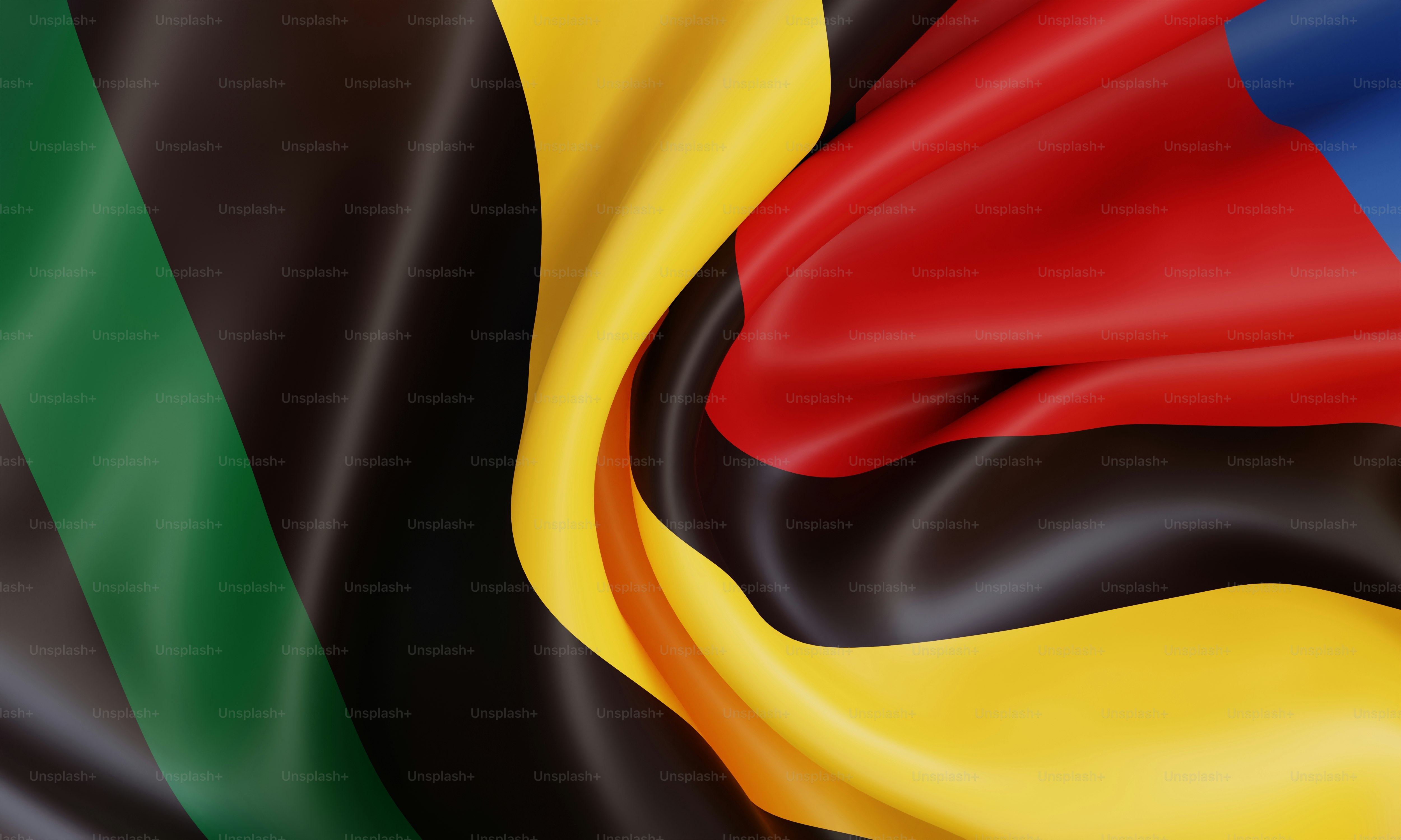 Abstract flowing fabric with green, yellow, red, and blue colors.