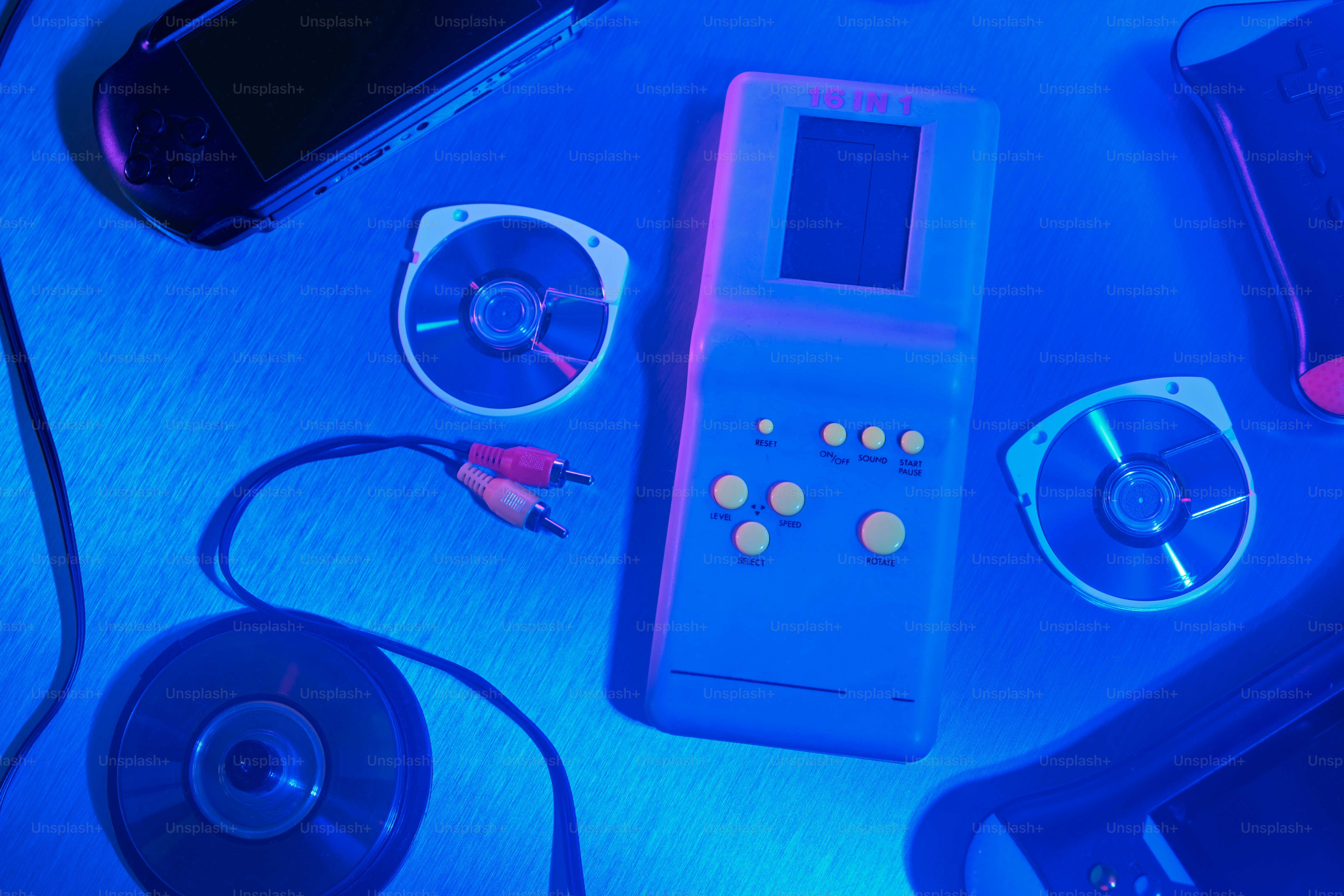 Retro gaming devices and cds with neon lighting photo – Vintage Image ...