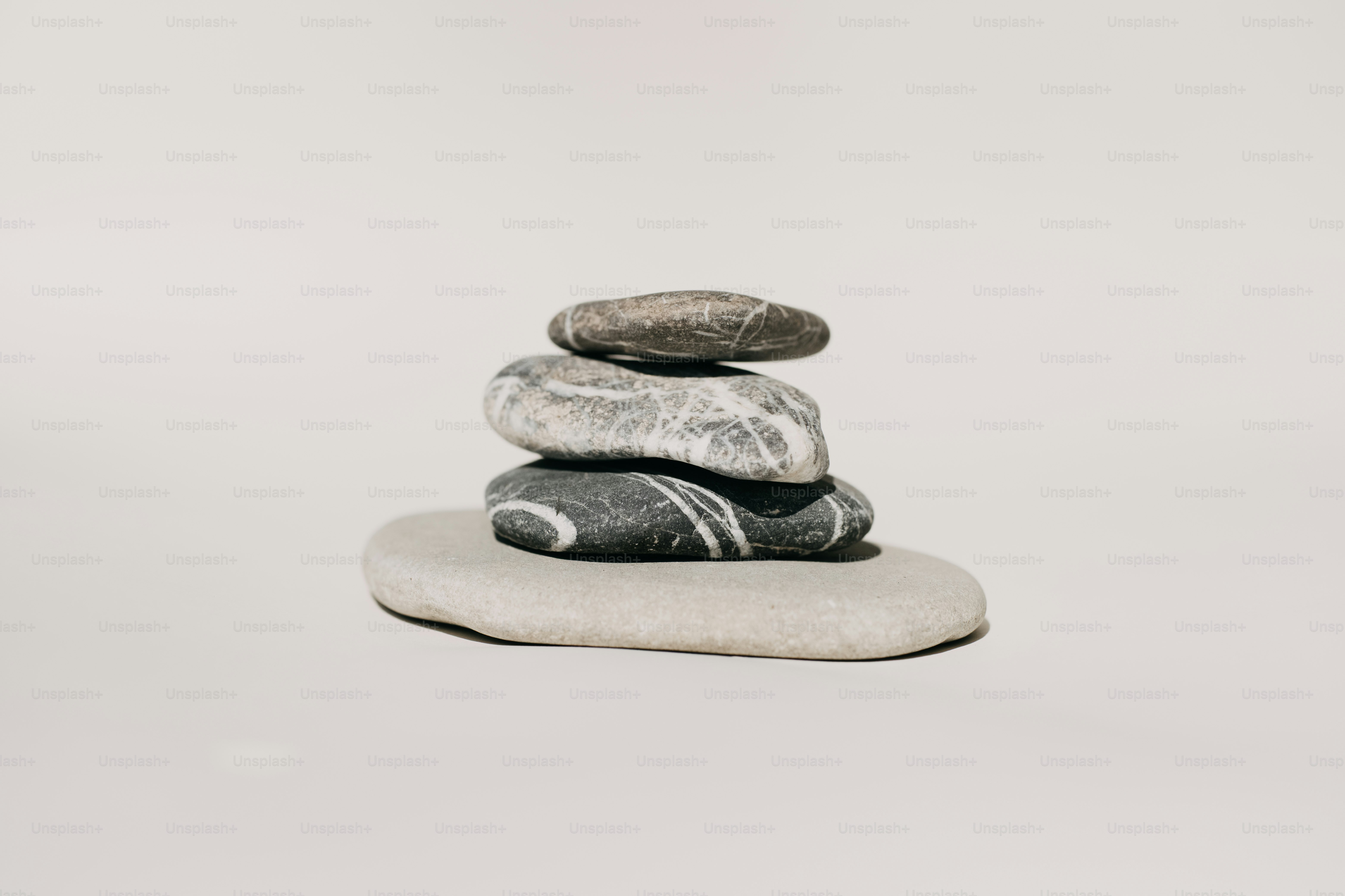 Stack of balanced stones on a light background