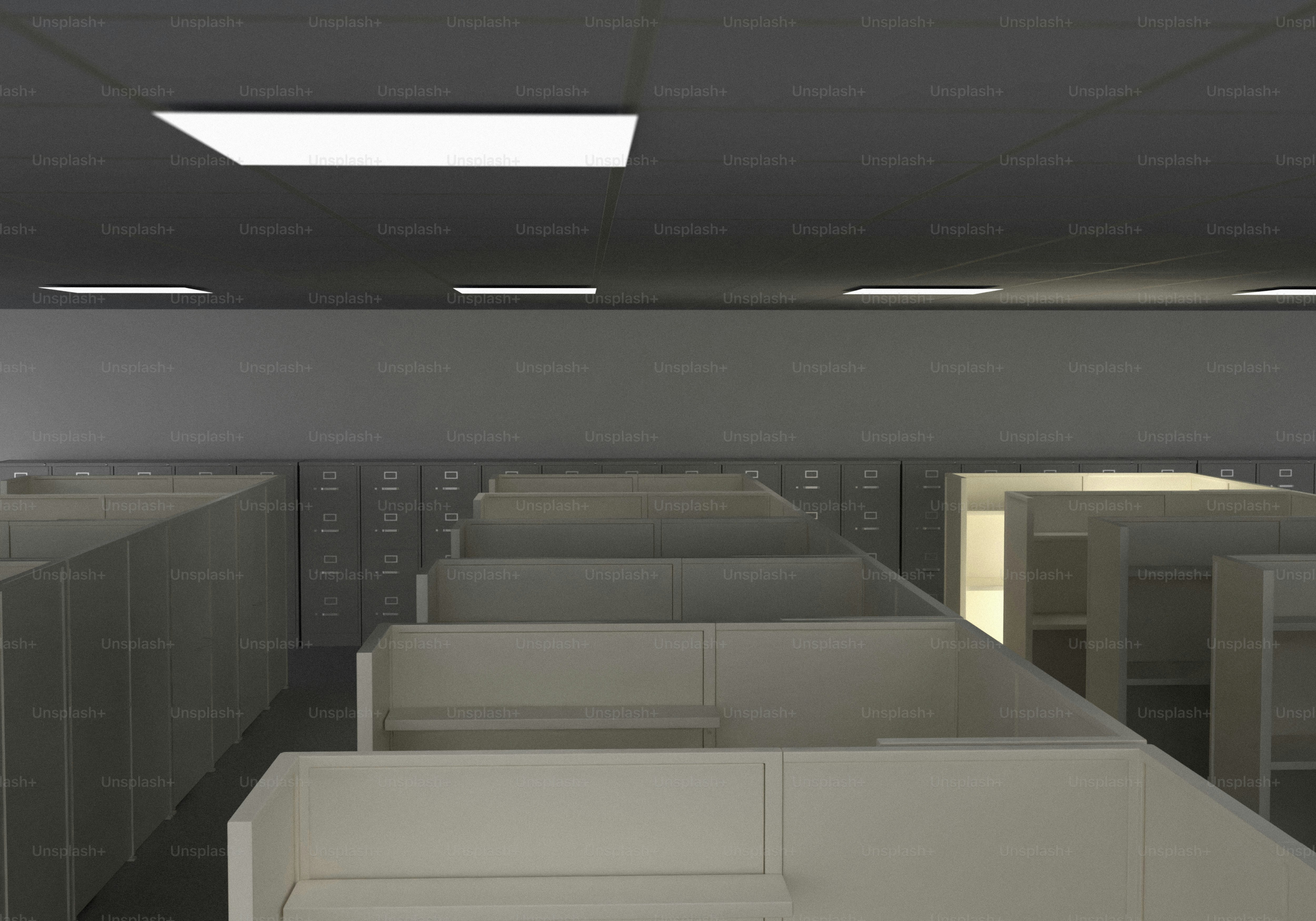 Empty office cubicles at night with one lit computer screen. photo ...