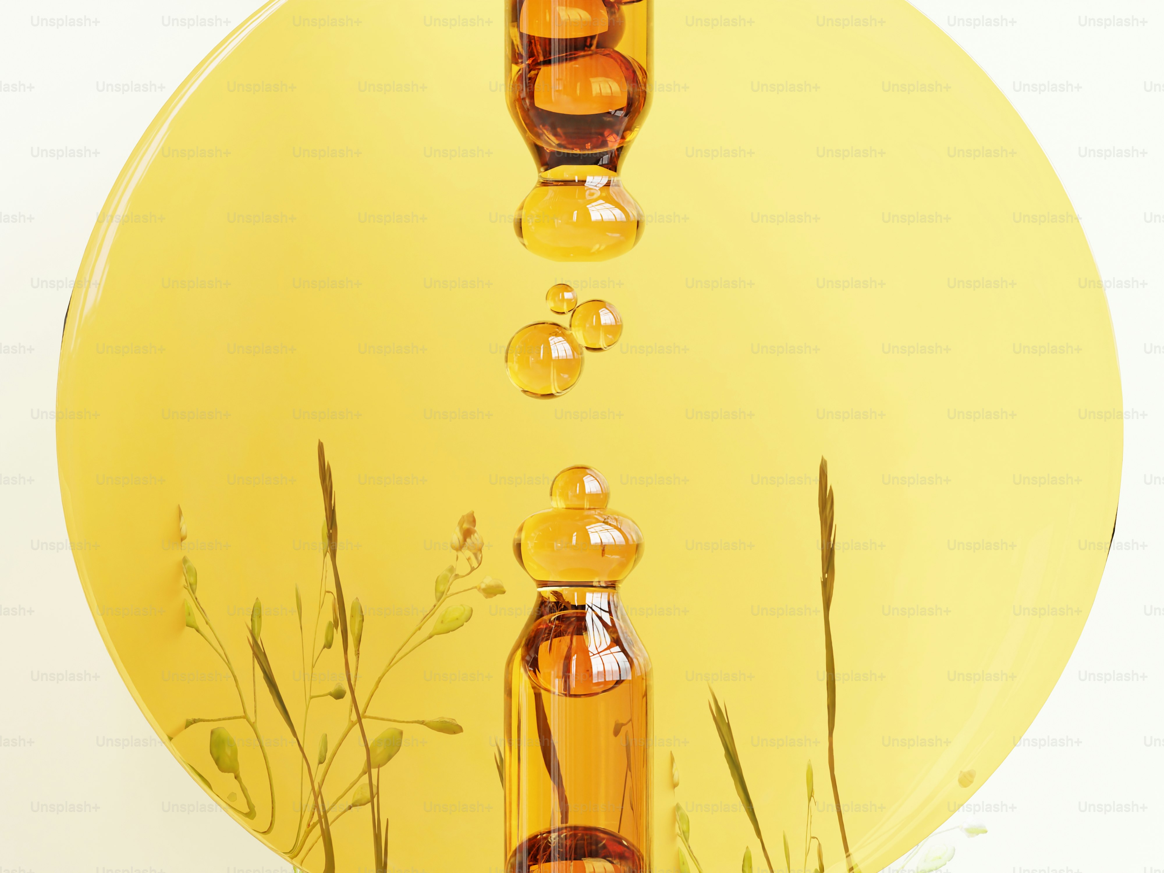 Líquido ámbar gotea del cuentagotas sobre la hierba