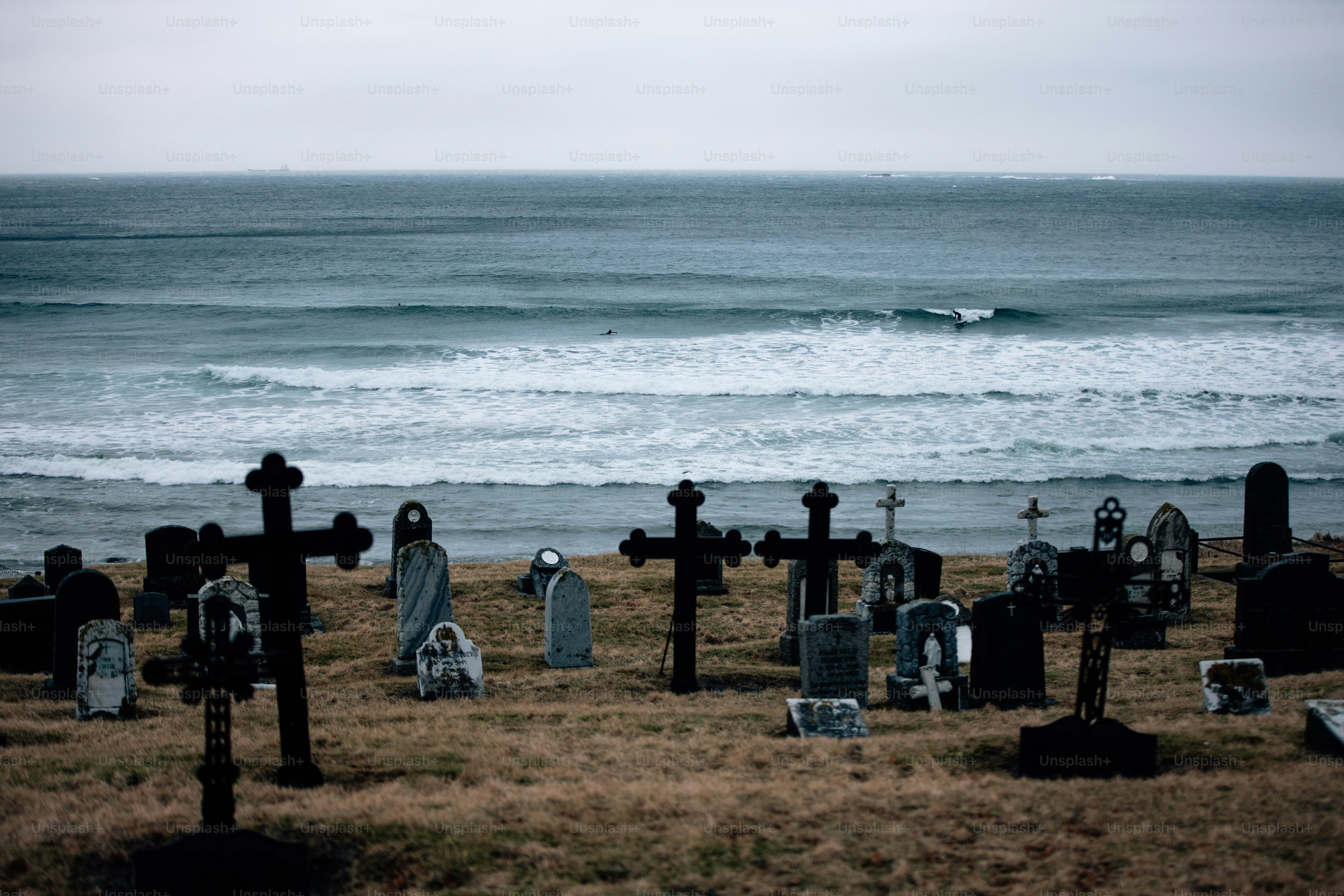 Graveyard overlooking the ocean on a cloudy day