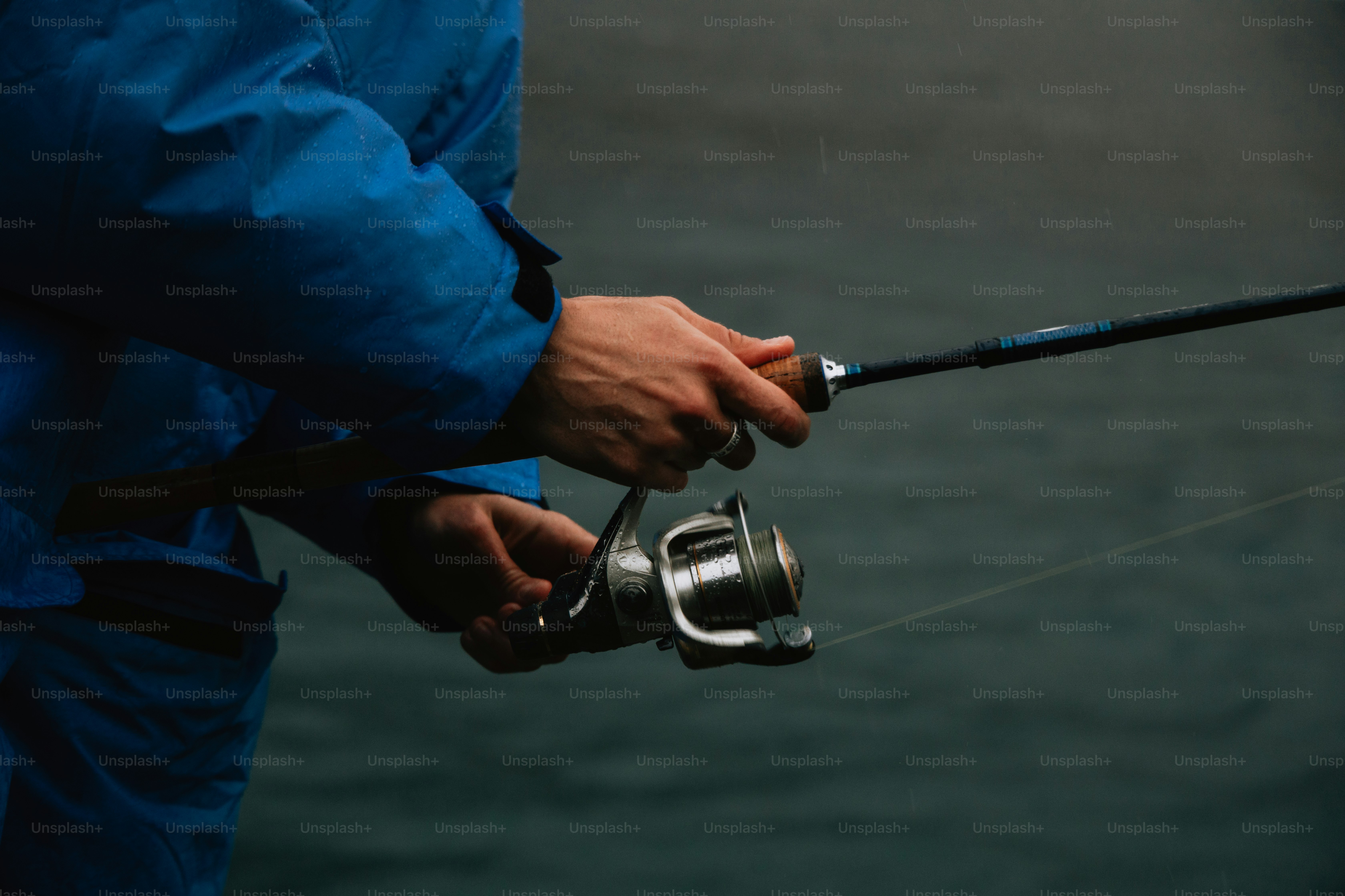 Person holding a fishing rod with reel photo – Fishing Image on Unsplash