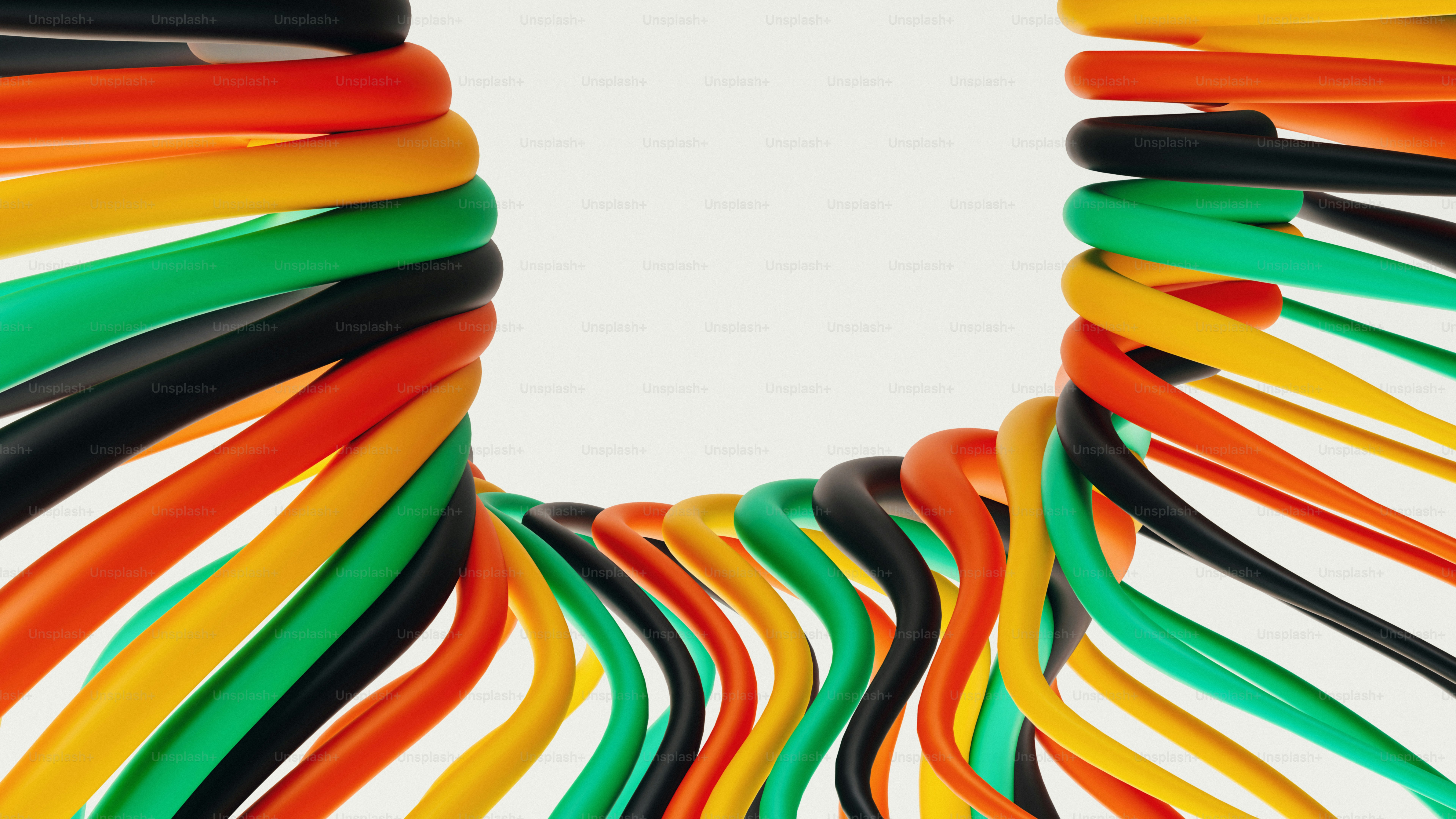 Kabel warna-warni disusun dalam bentuk u dengan latar belakang putih