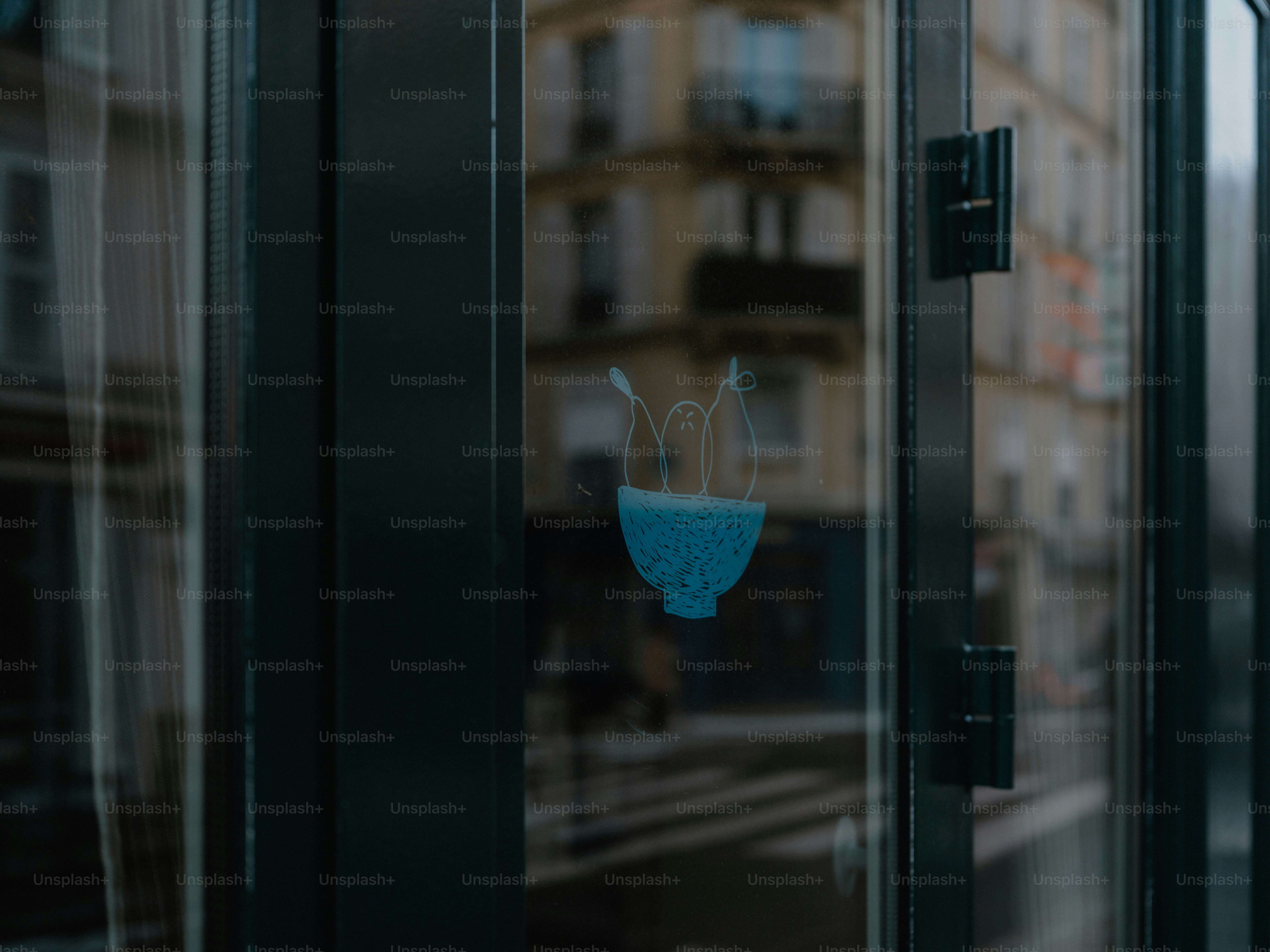Blue jellyfish sticker on a glass door