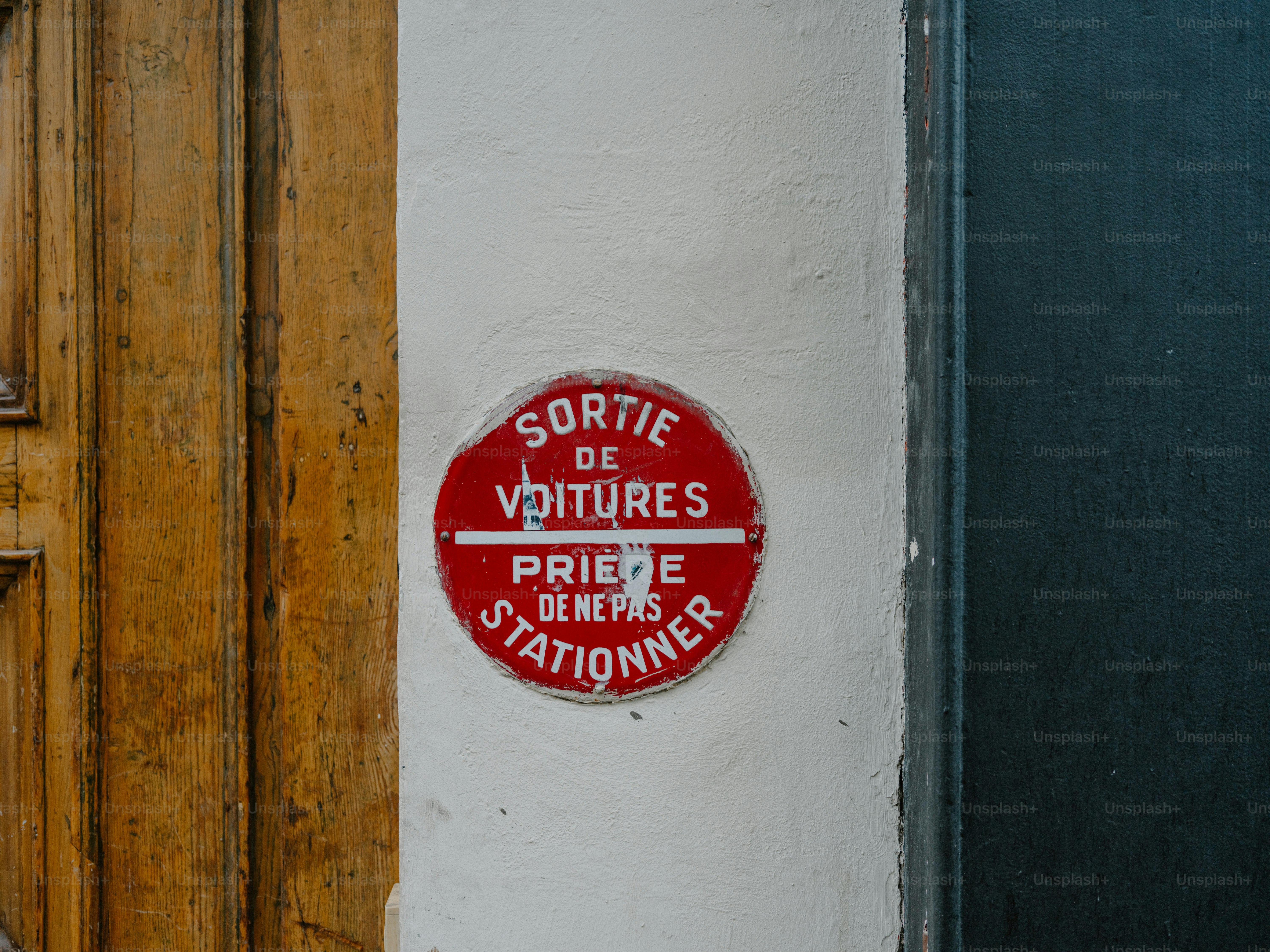 Red sign with french text about parking