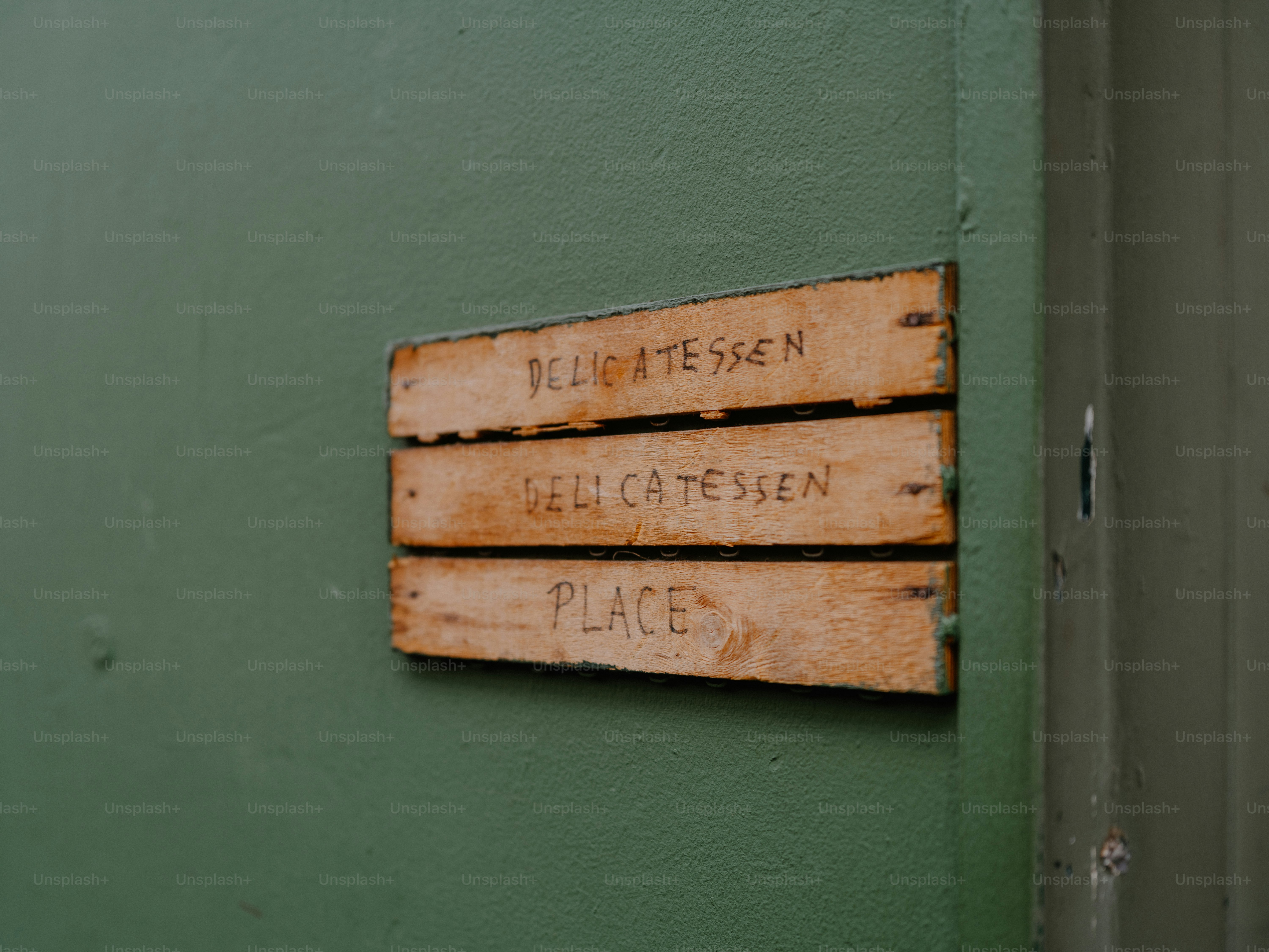 Wooden sign for delicatessen place