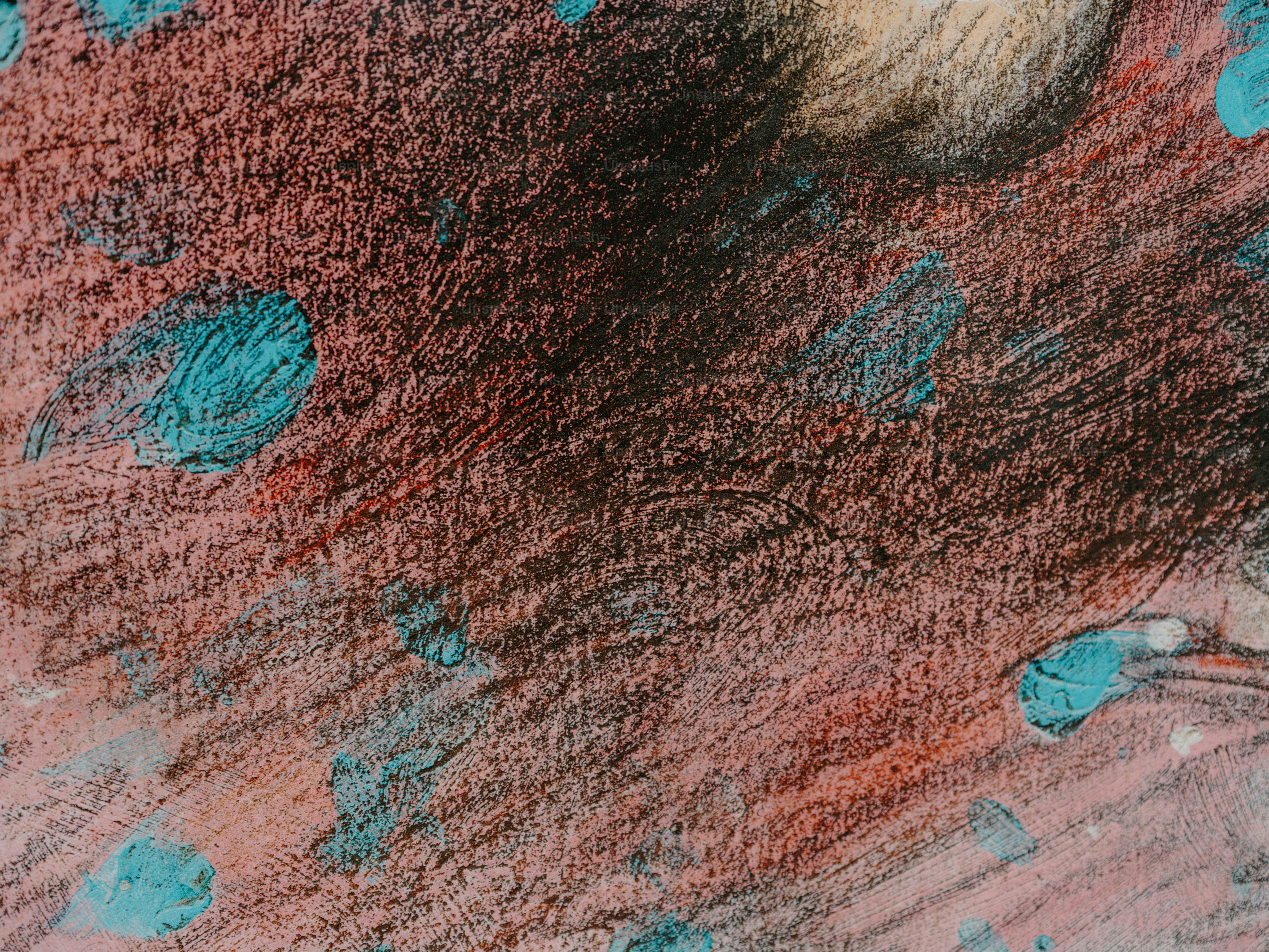 Abstract textured background with blue and red splotches.