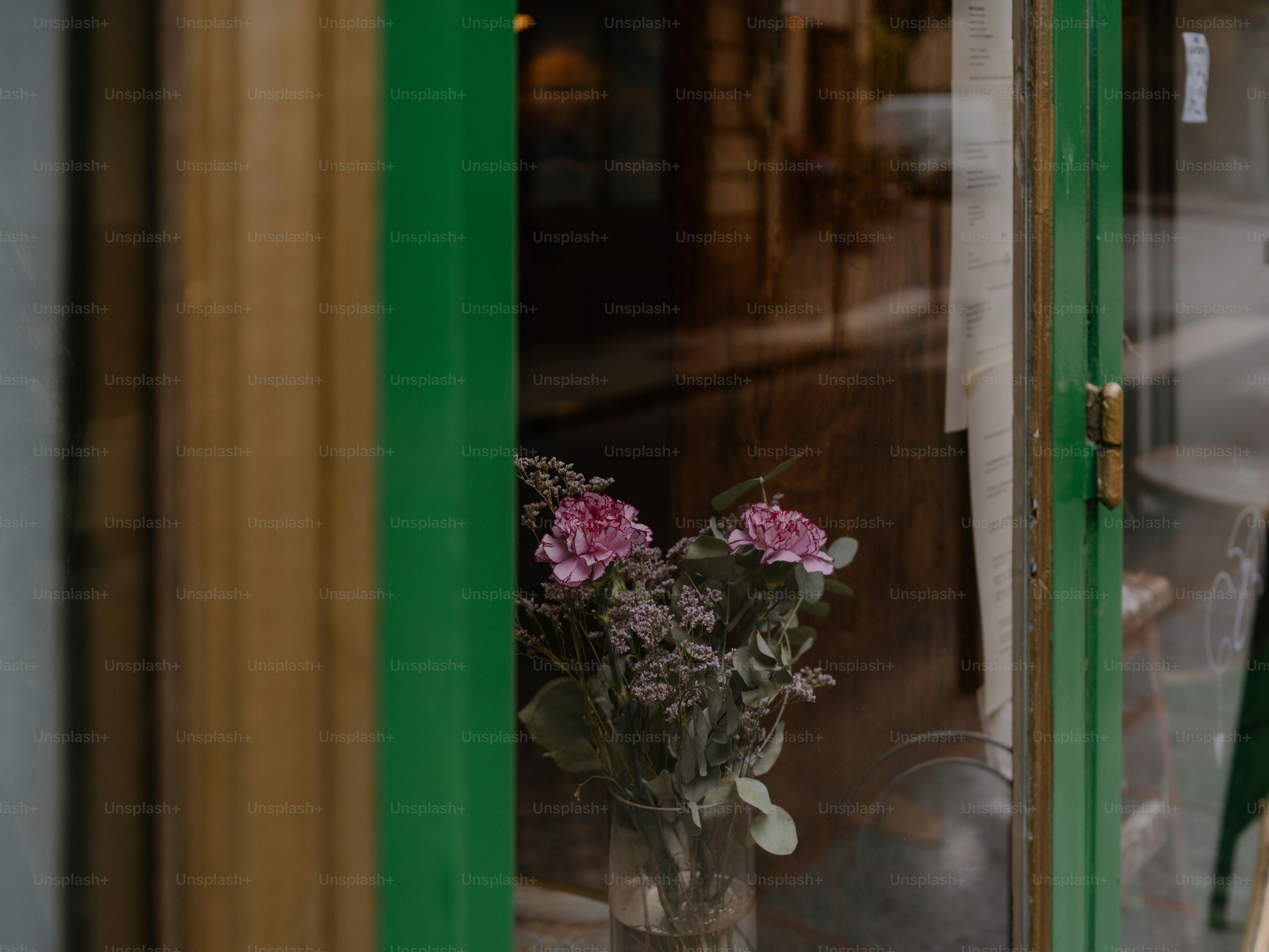 Bouquet of withered flowers in a glass vase.