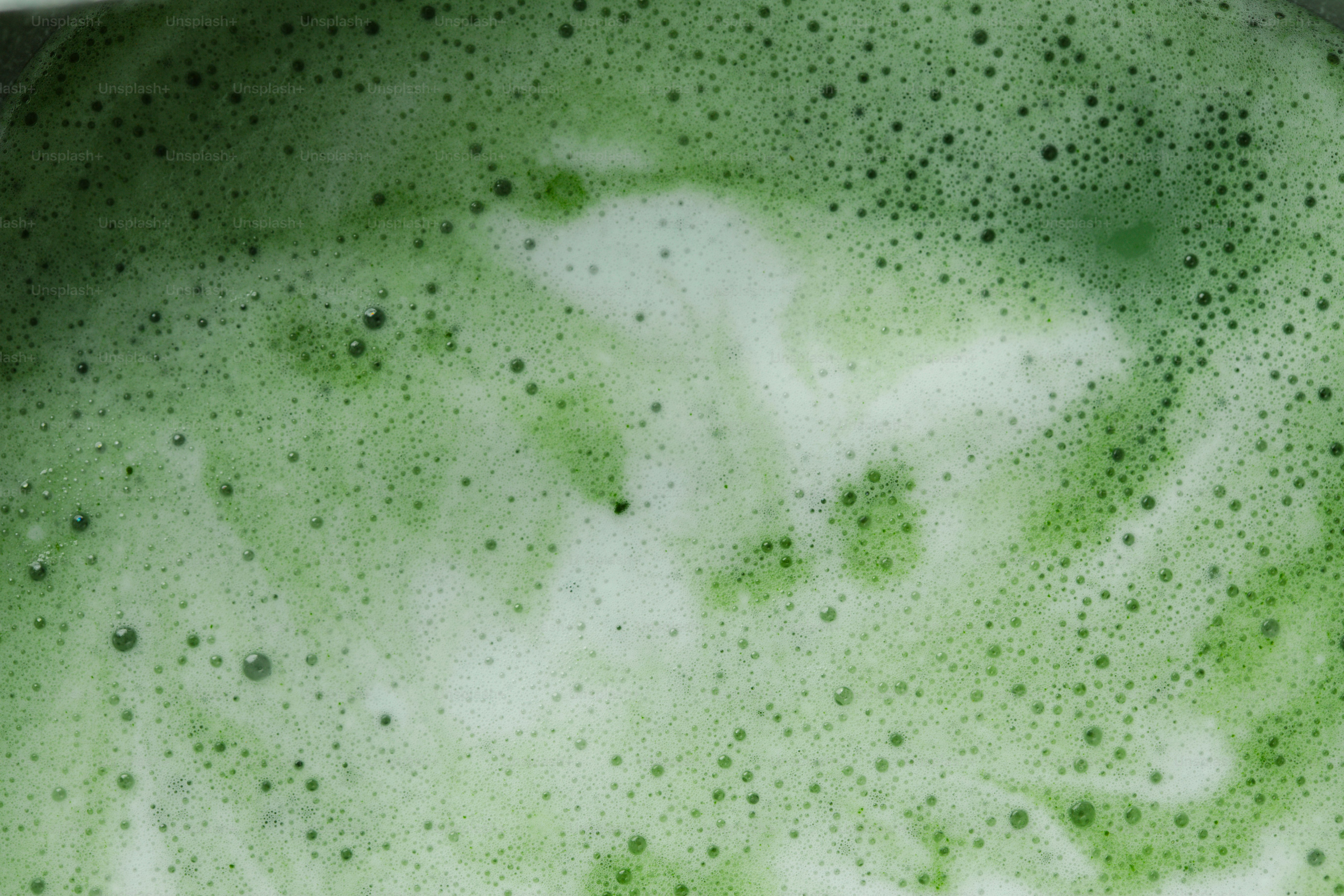 Green foamy liquid with white swirls