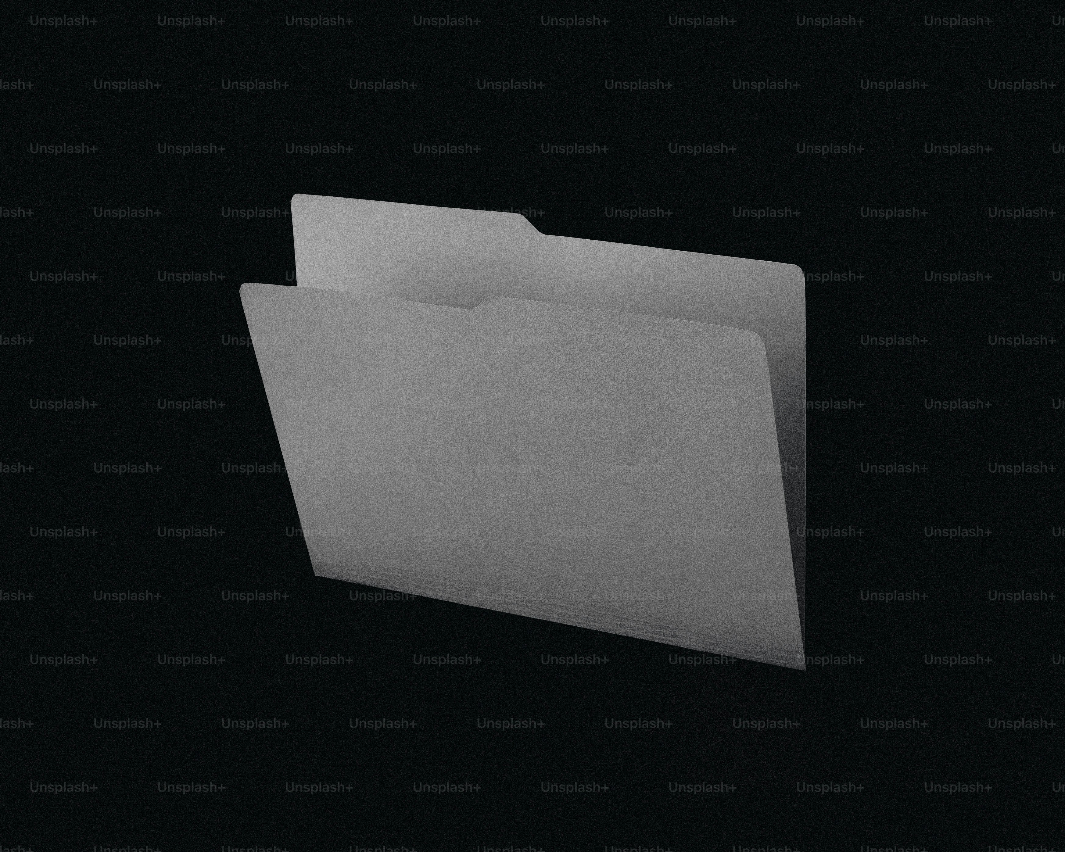 A gray manila folder on a black background