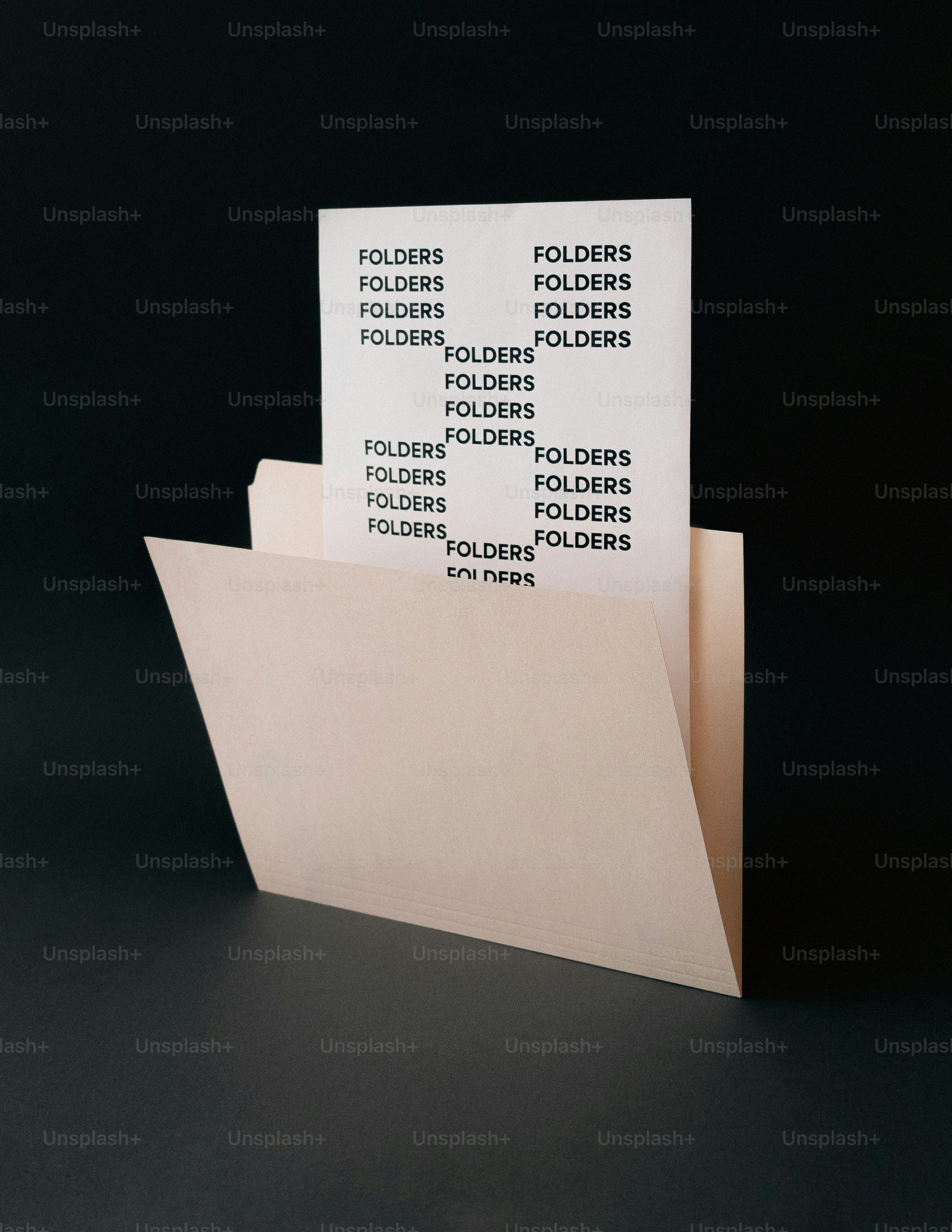 A manila folder with paper listing the word folders. photo – Paper ...