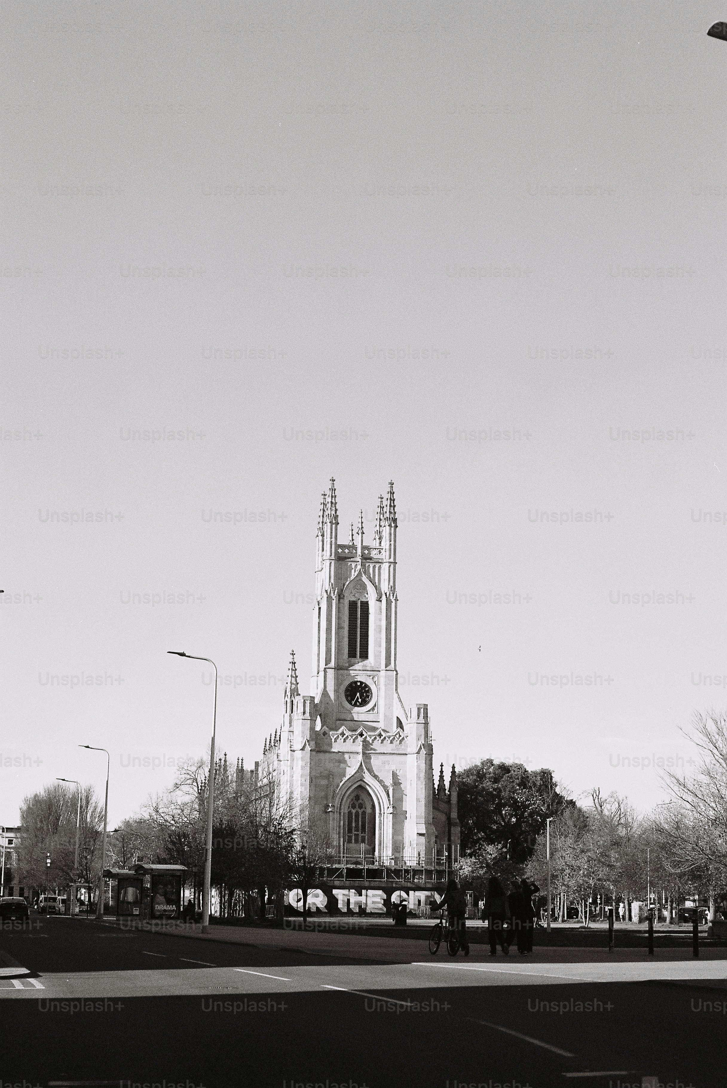 Gothic church with a tall spire against a clear sky.