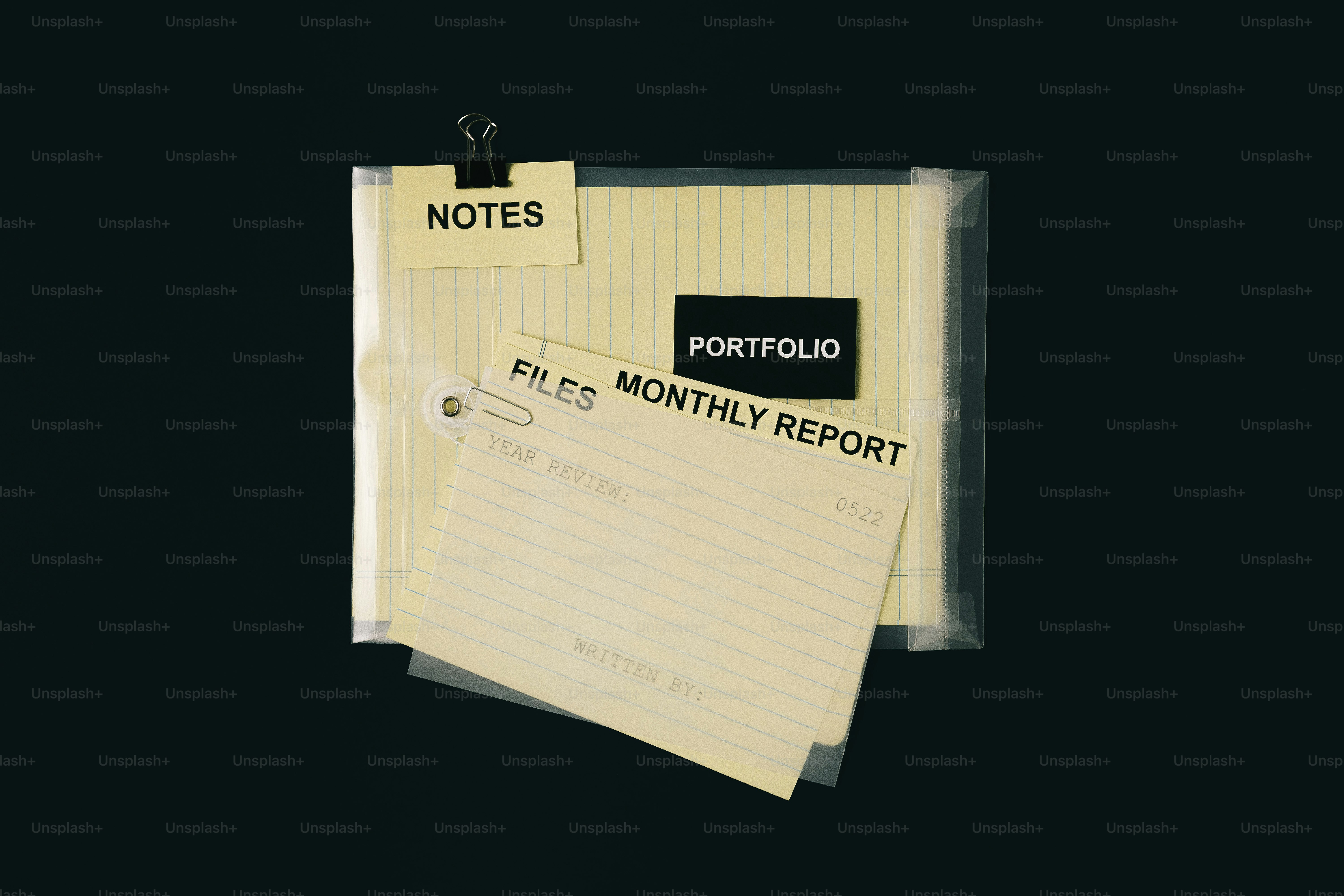 Folder with portfolio and monthly report papers