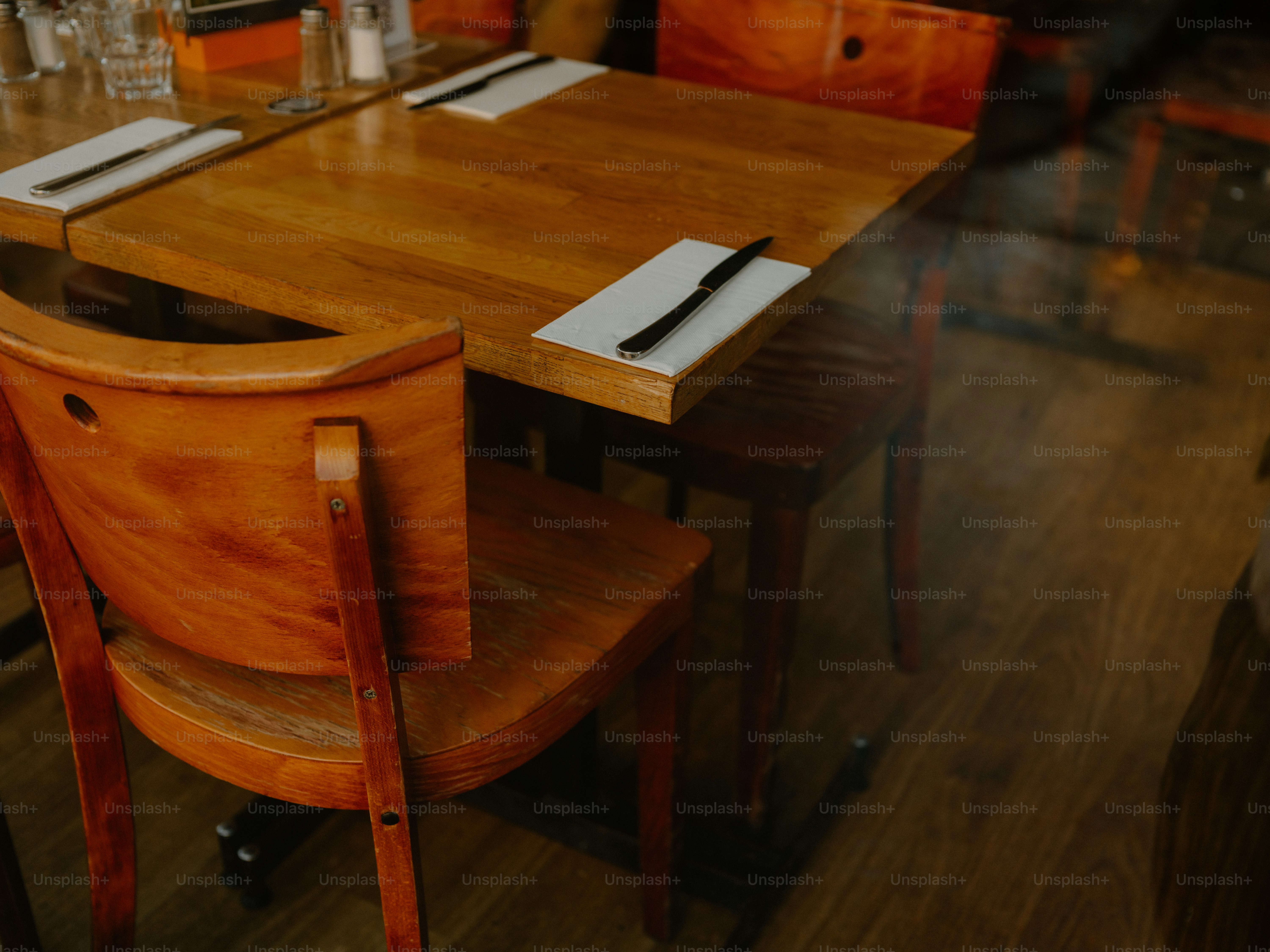 Wooden chairs and tables set for dining