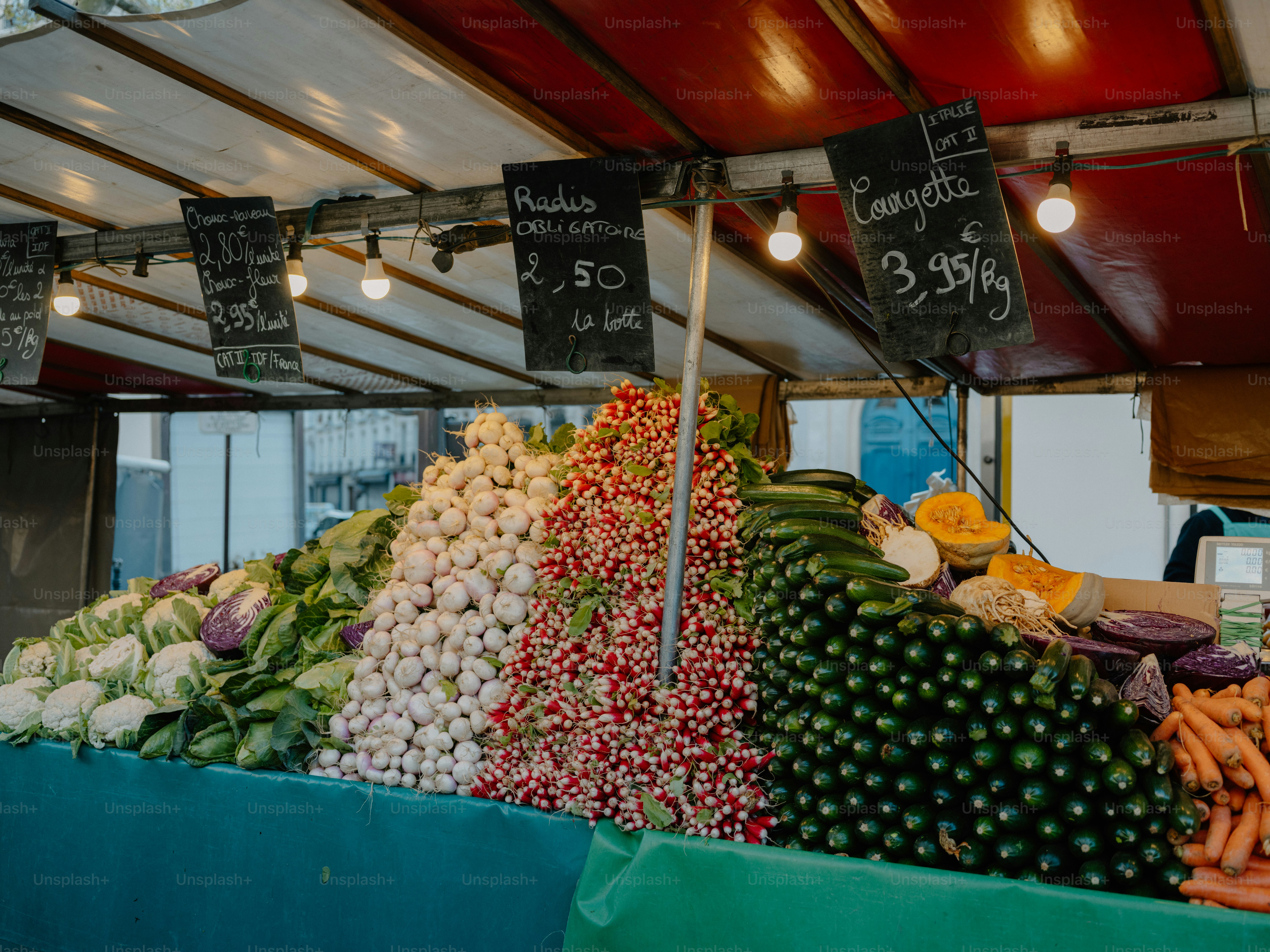 Fresh vegetables and produce displayed at an outdoor market