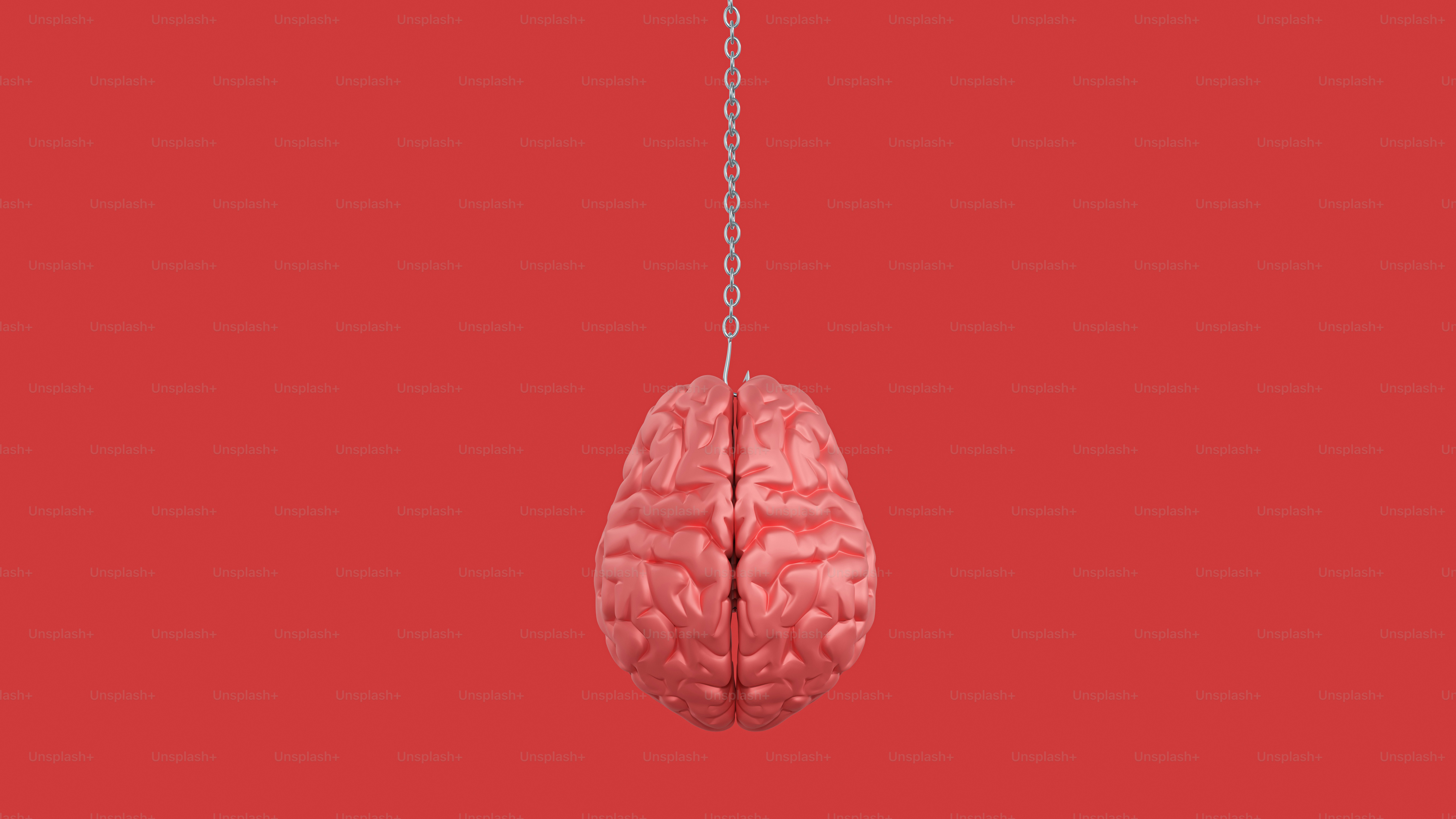 A pink brain hanging from a silver chain