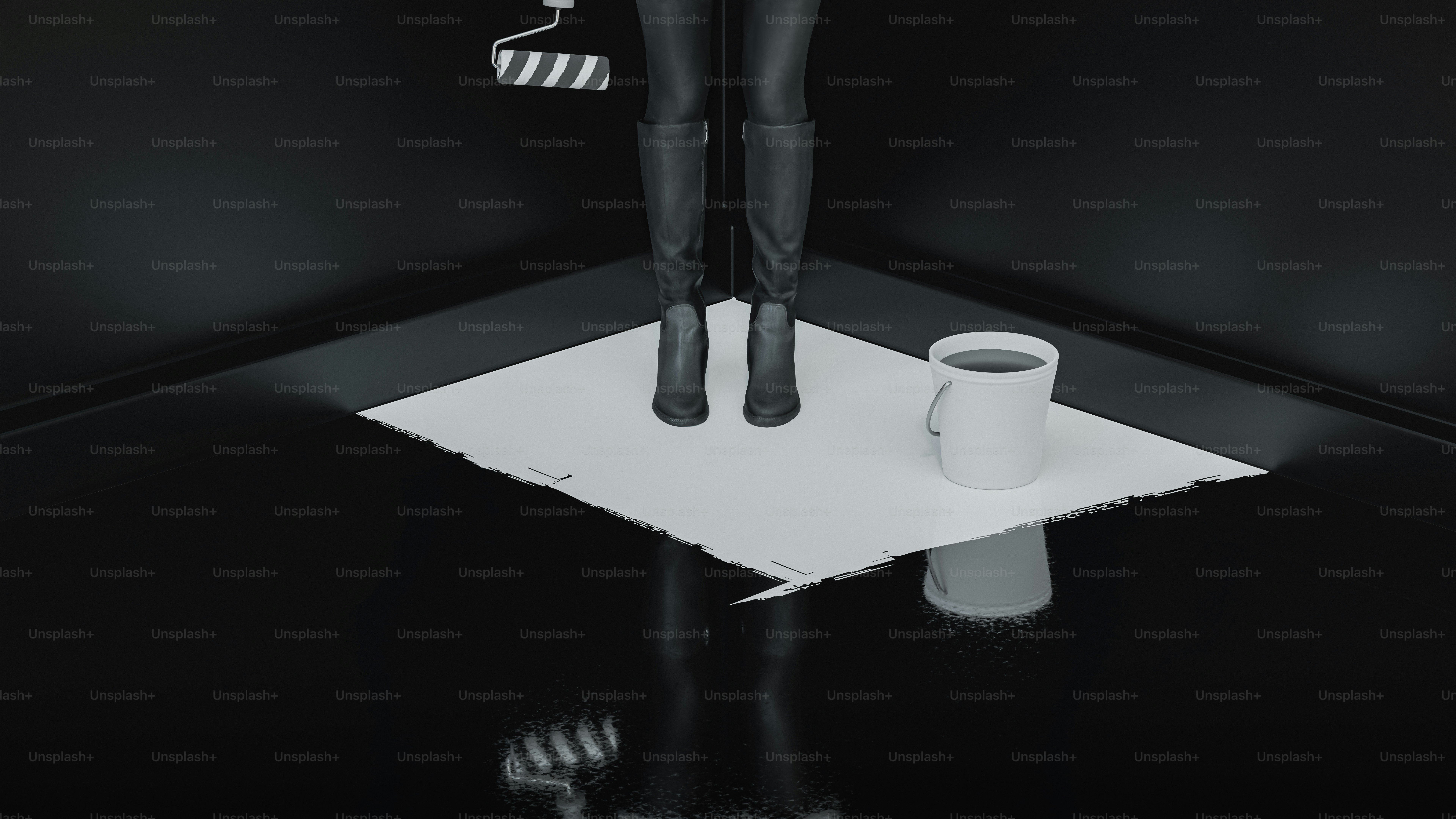 A person stands on a white sheet with paint supplies.