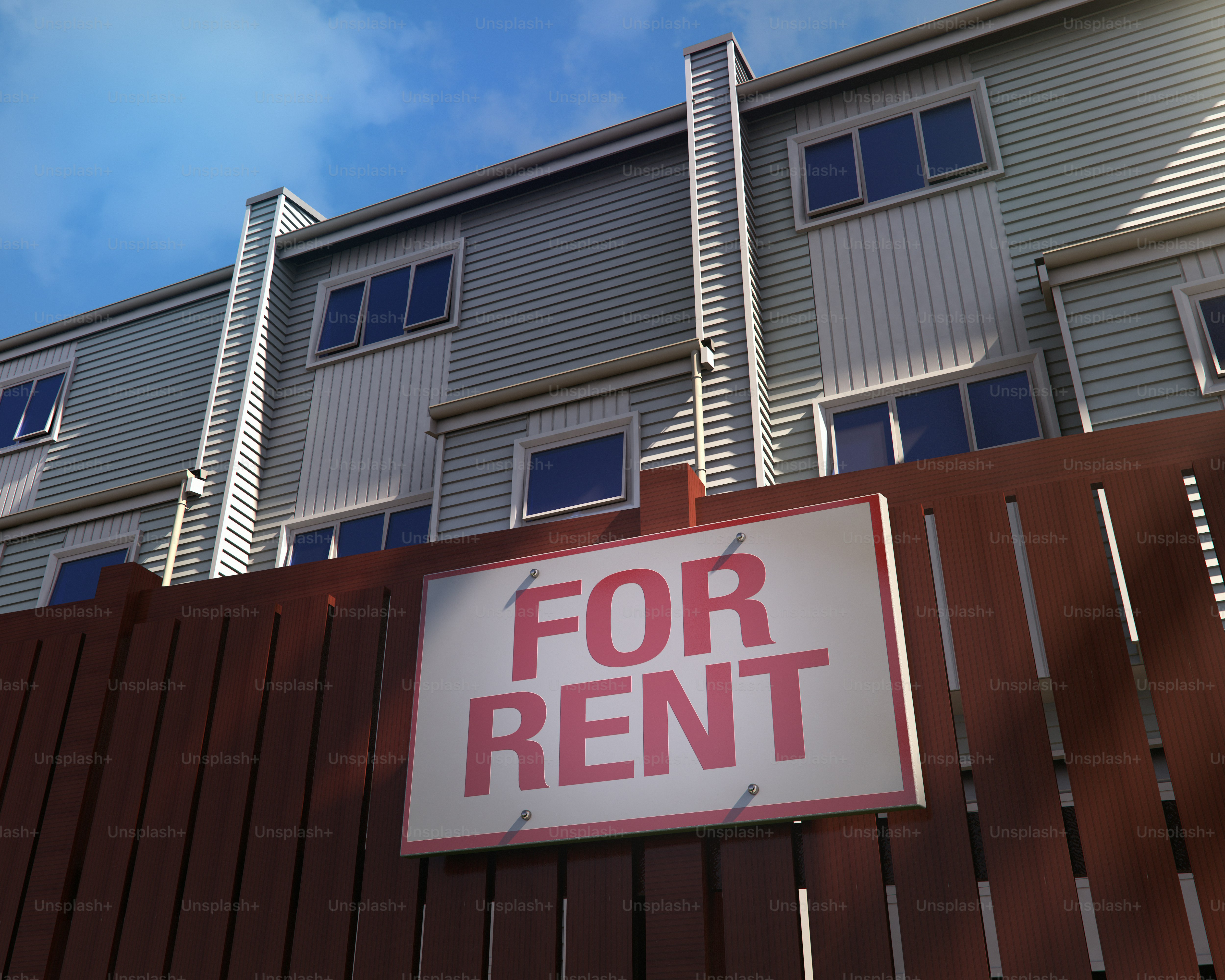 For rent sign on wooden fence with townhouses behind photo – Building ...
