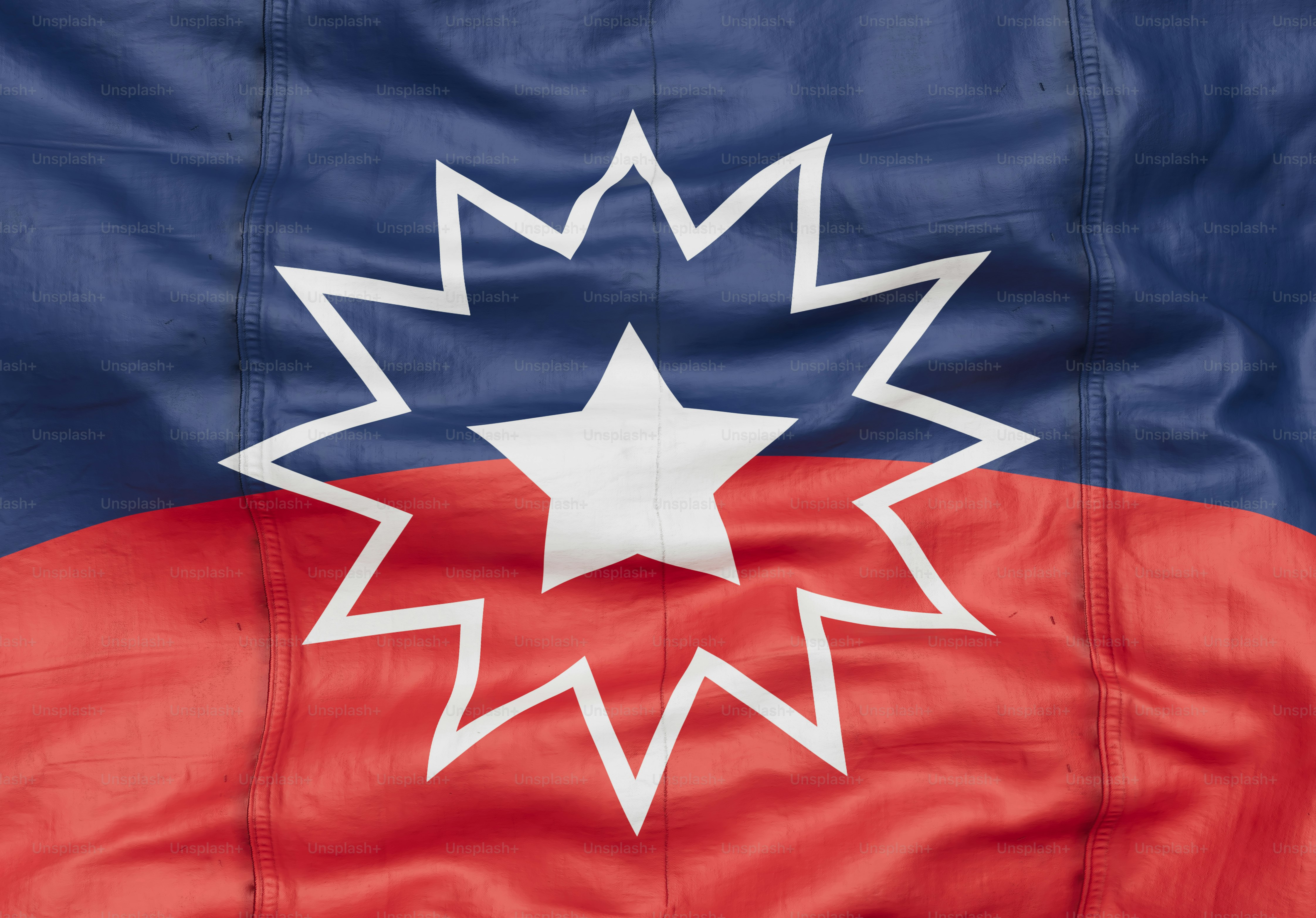 Juneteenth flag with white starburst and white star.