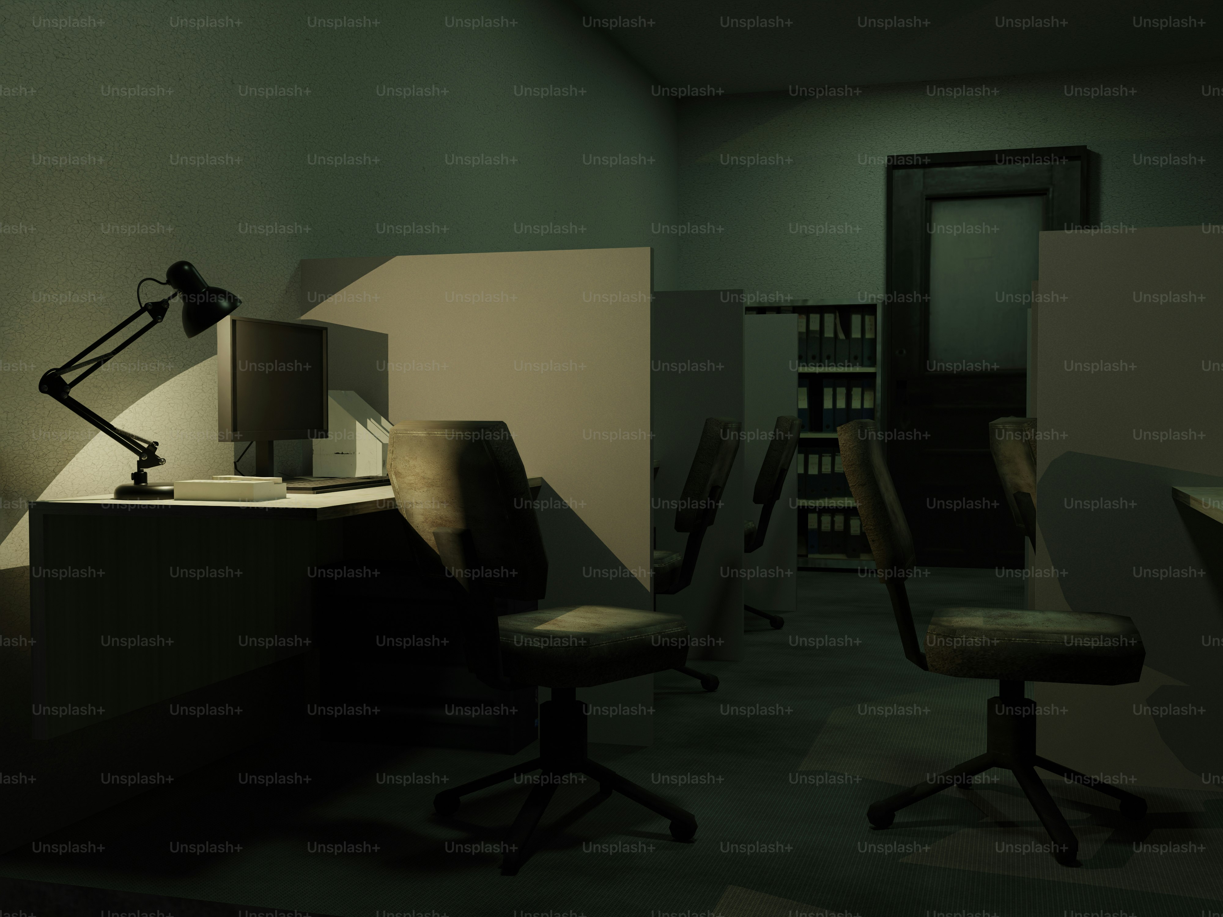 Empty office cubicles with desk lamp and chairs.
