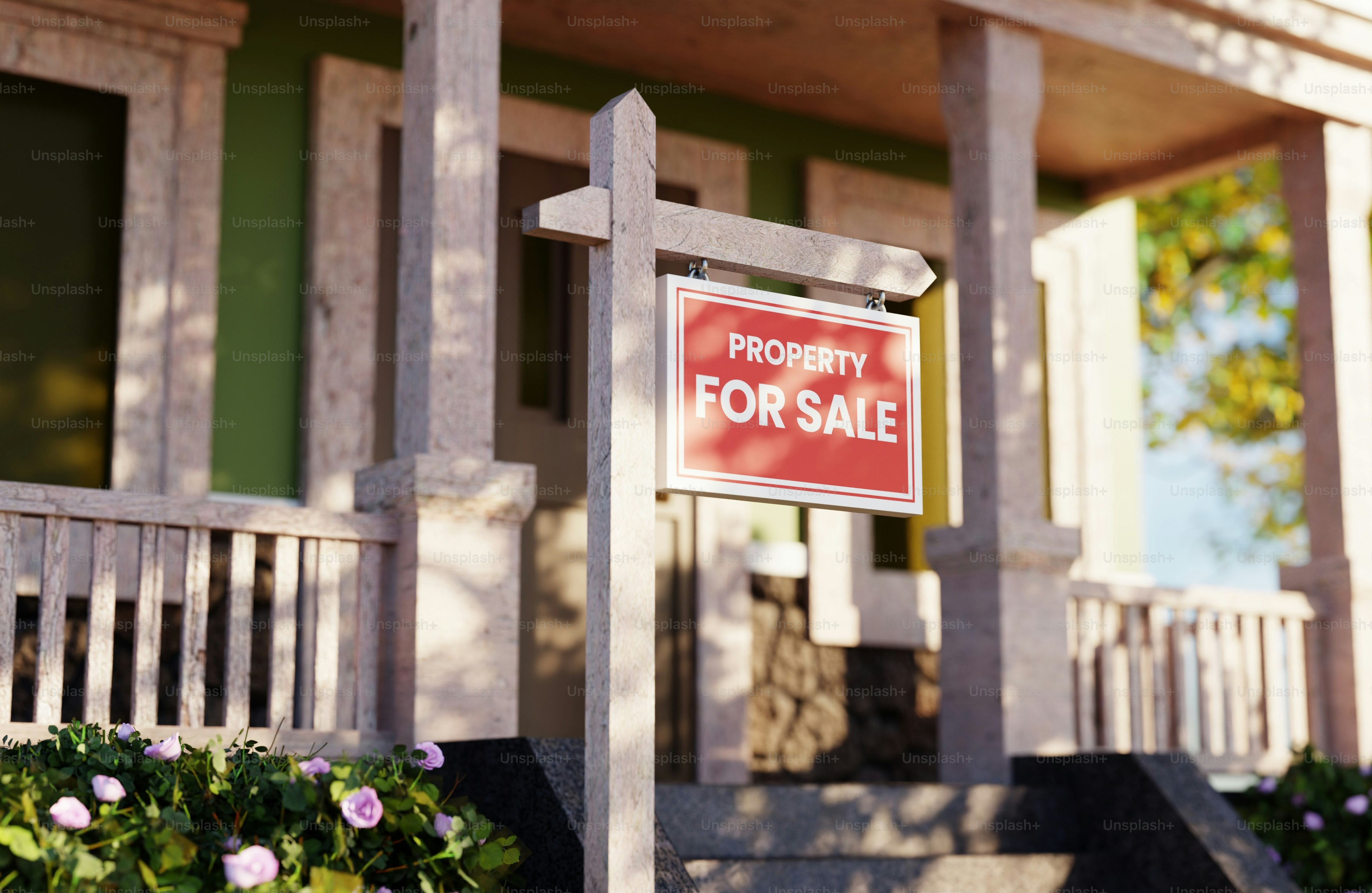 집 앞에 '부동산 매물' 표지판이 붙어 있어요.