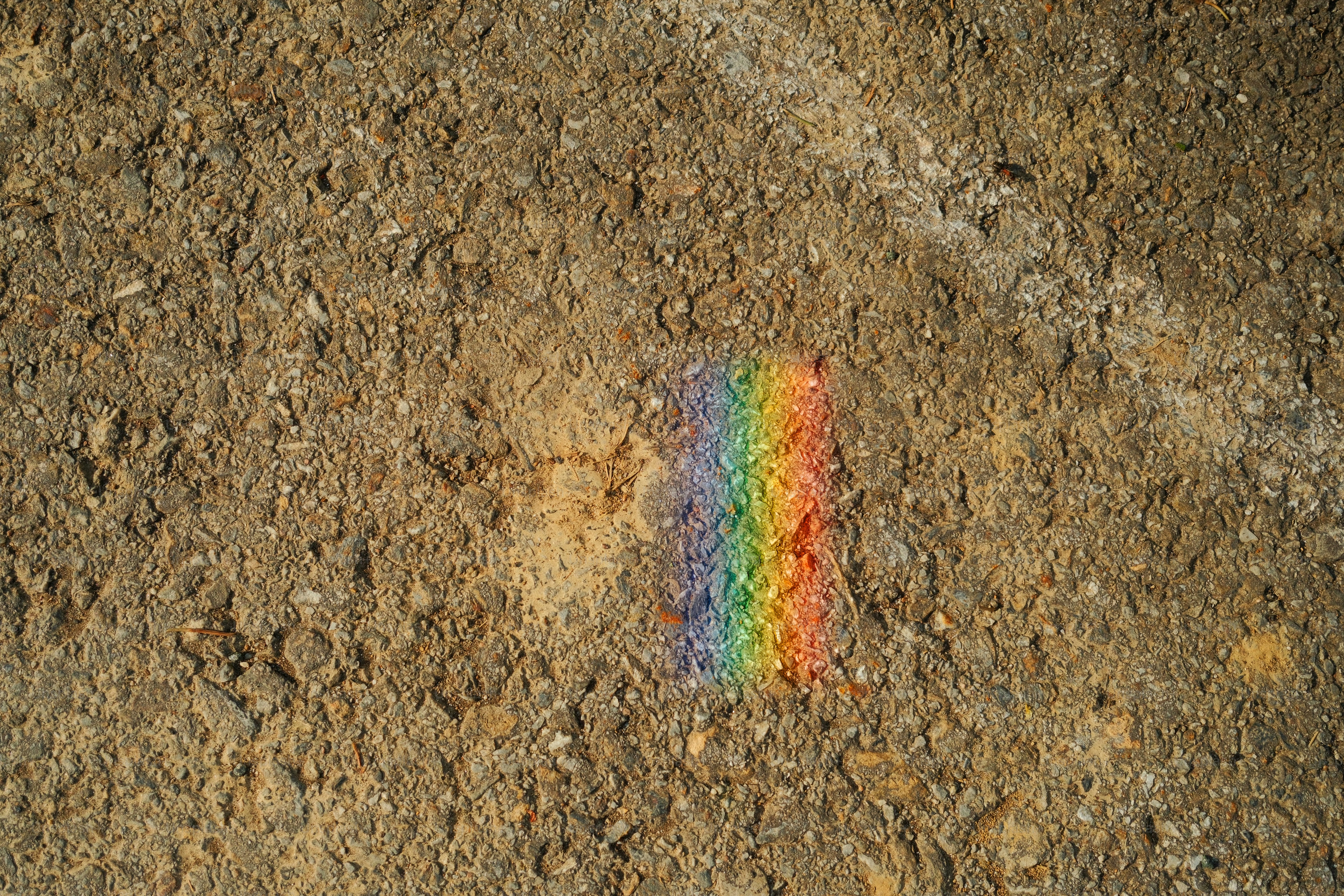 A rainbow spectrum on a textured surface.
