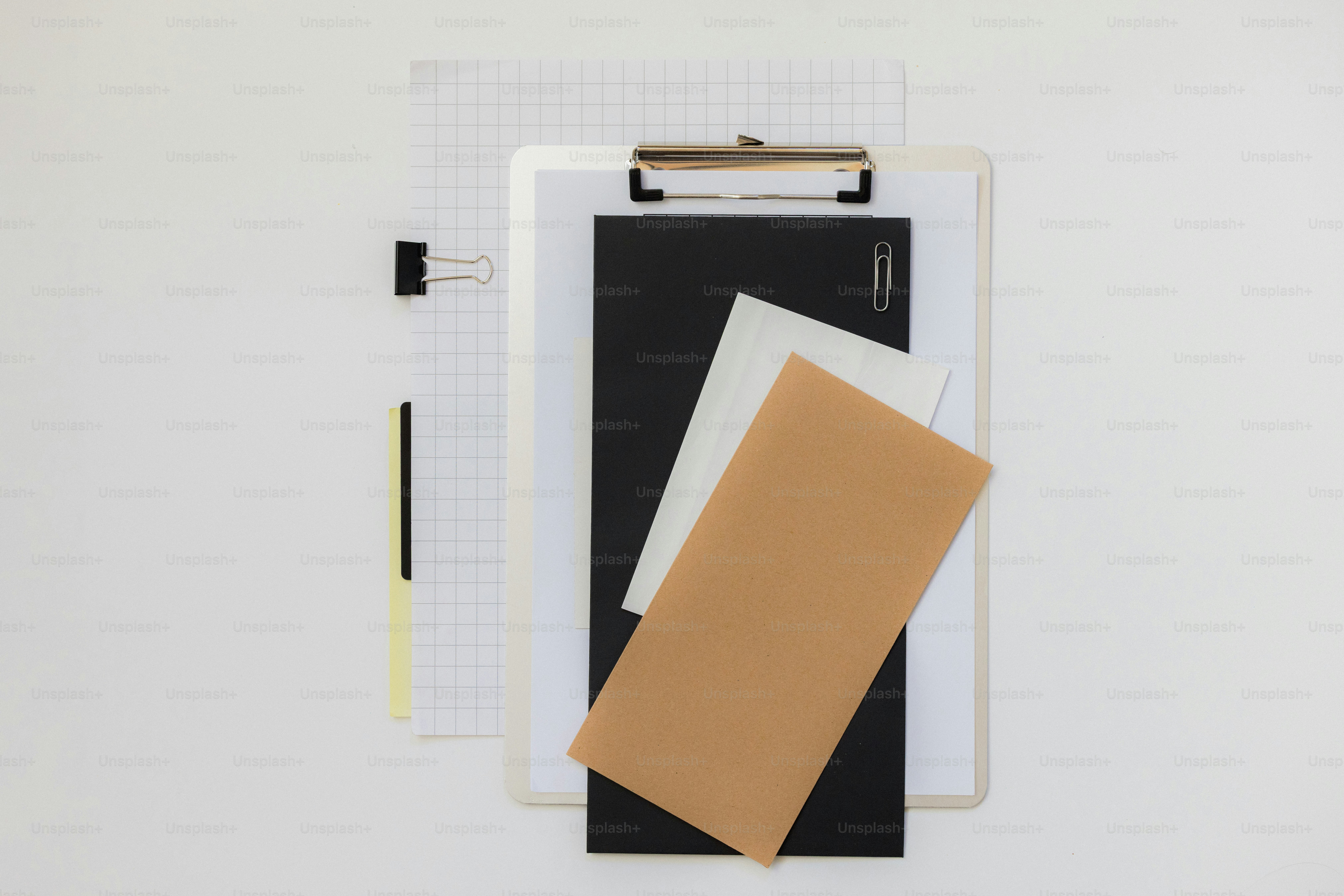 A blue folder with a paperclip and grid paper. photo – Business Image ...