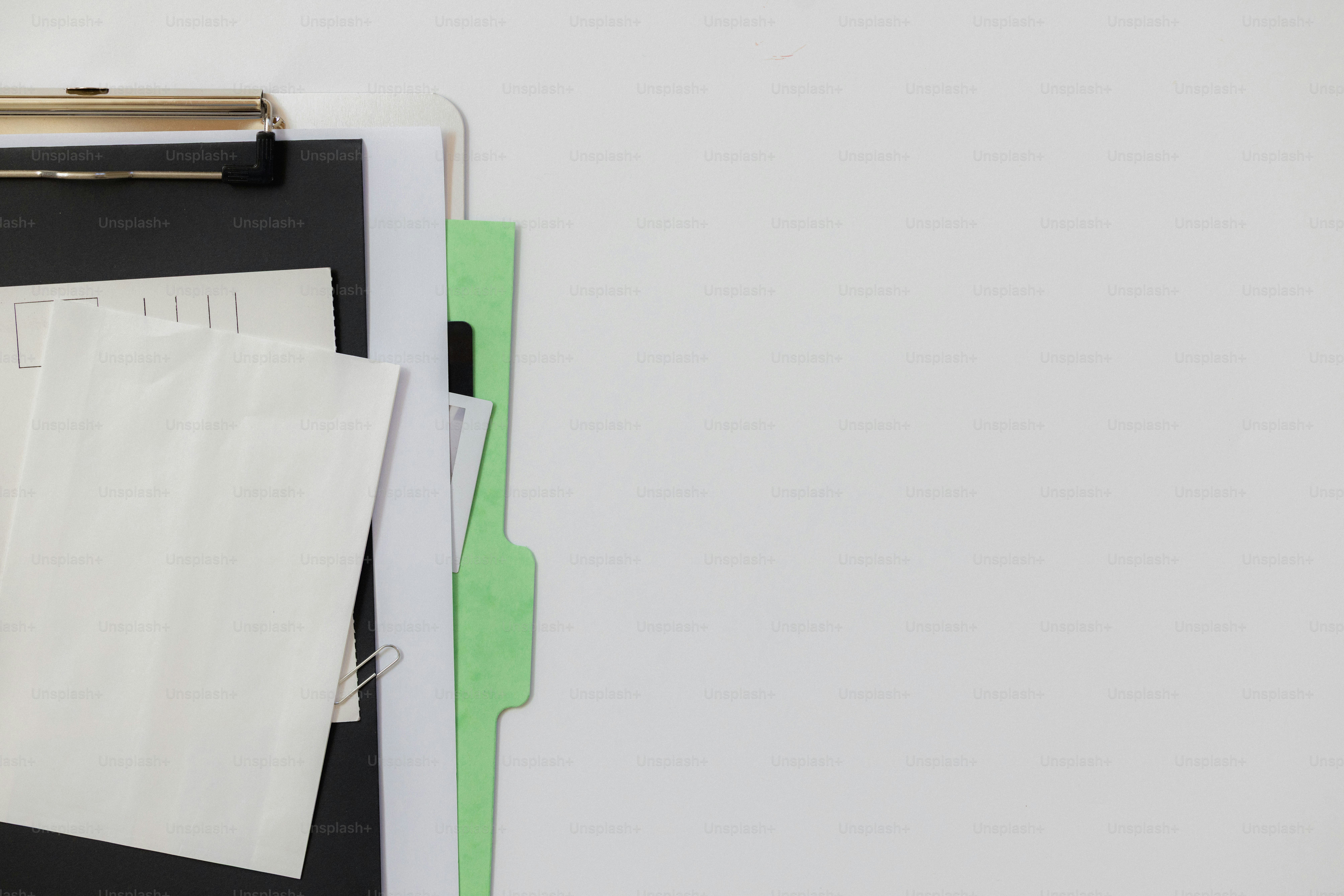 A blue folder with a paperclip and grid paper. photo – Business Image ...
