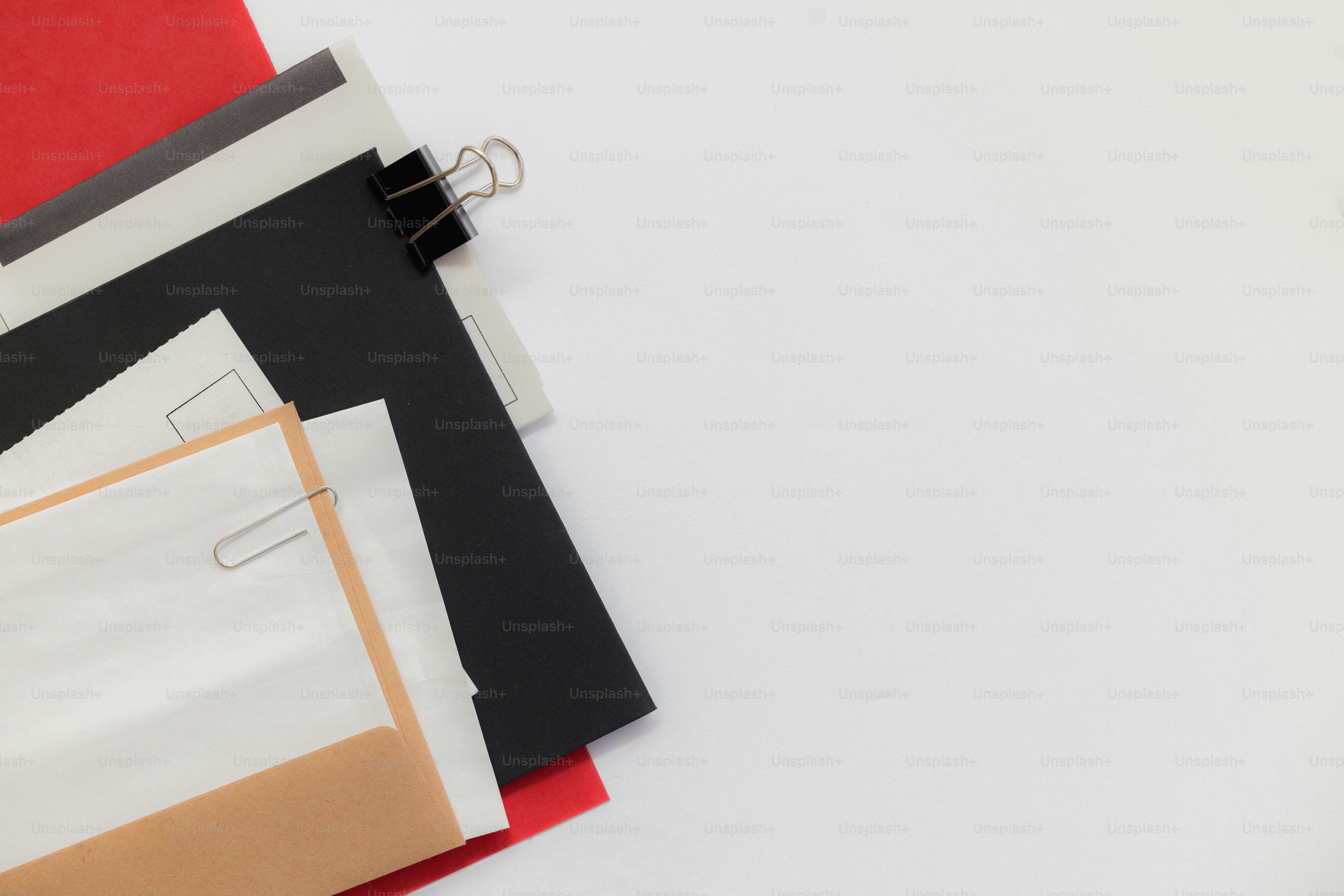 A blue folder with a paperclip and grid paper. photo – Business Image ...