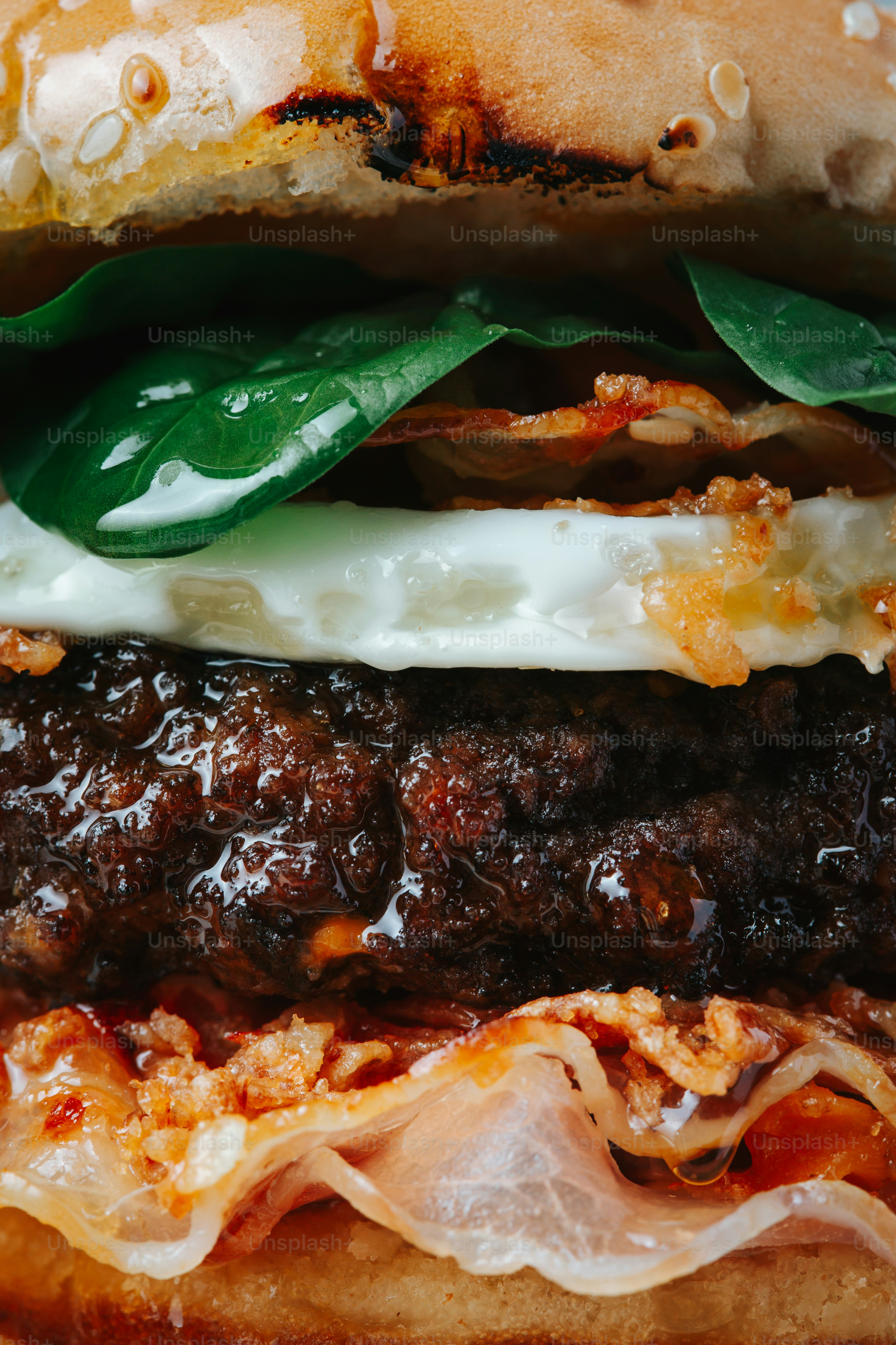 Close-up of a juicy gourmet burger with fresh ingredients.