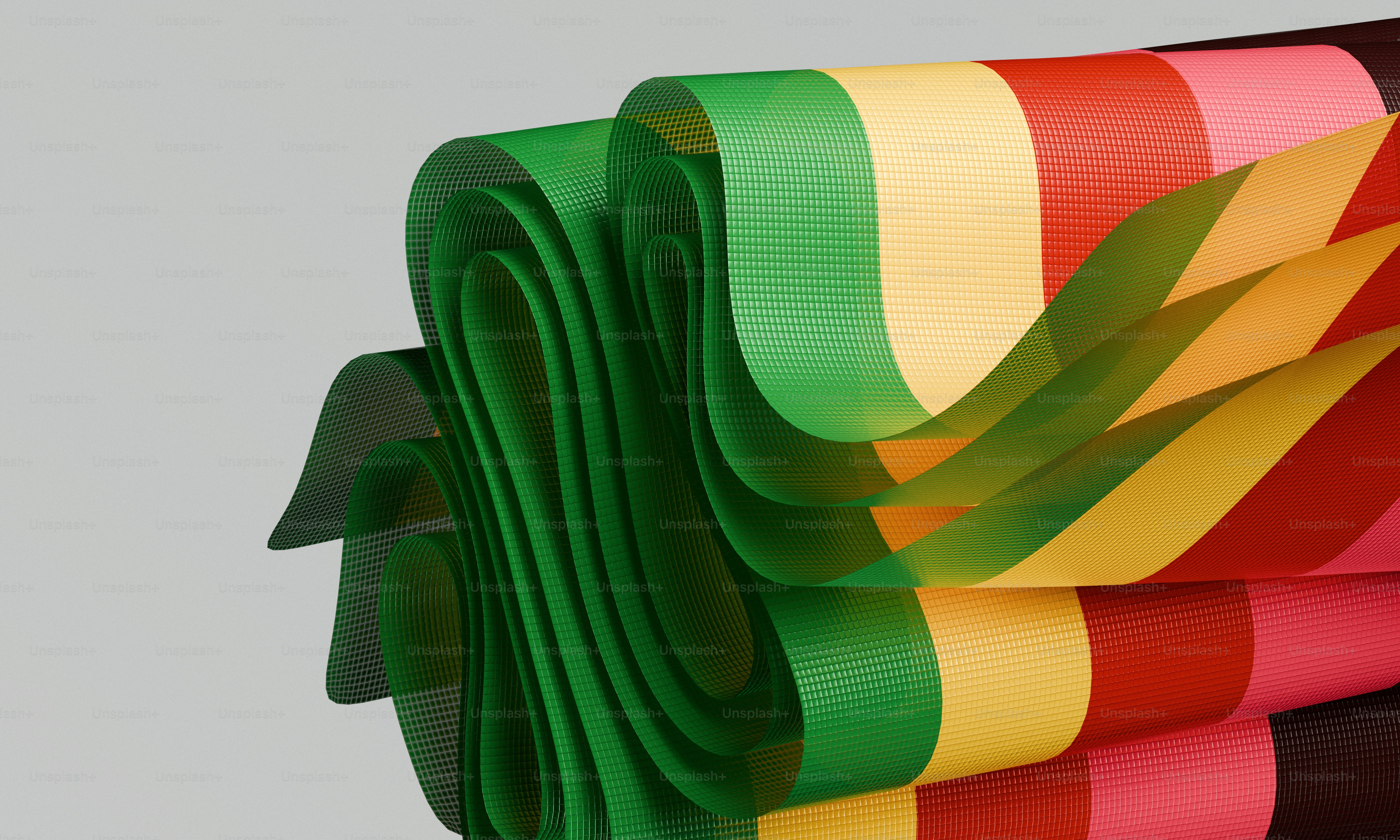 Colorful ribbons folded and layered against a light background
