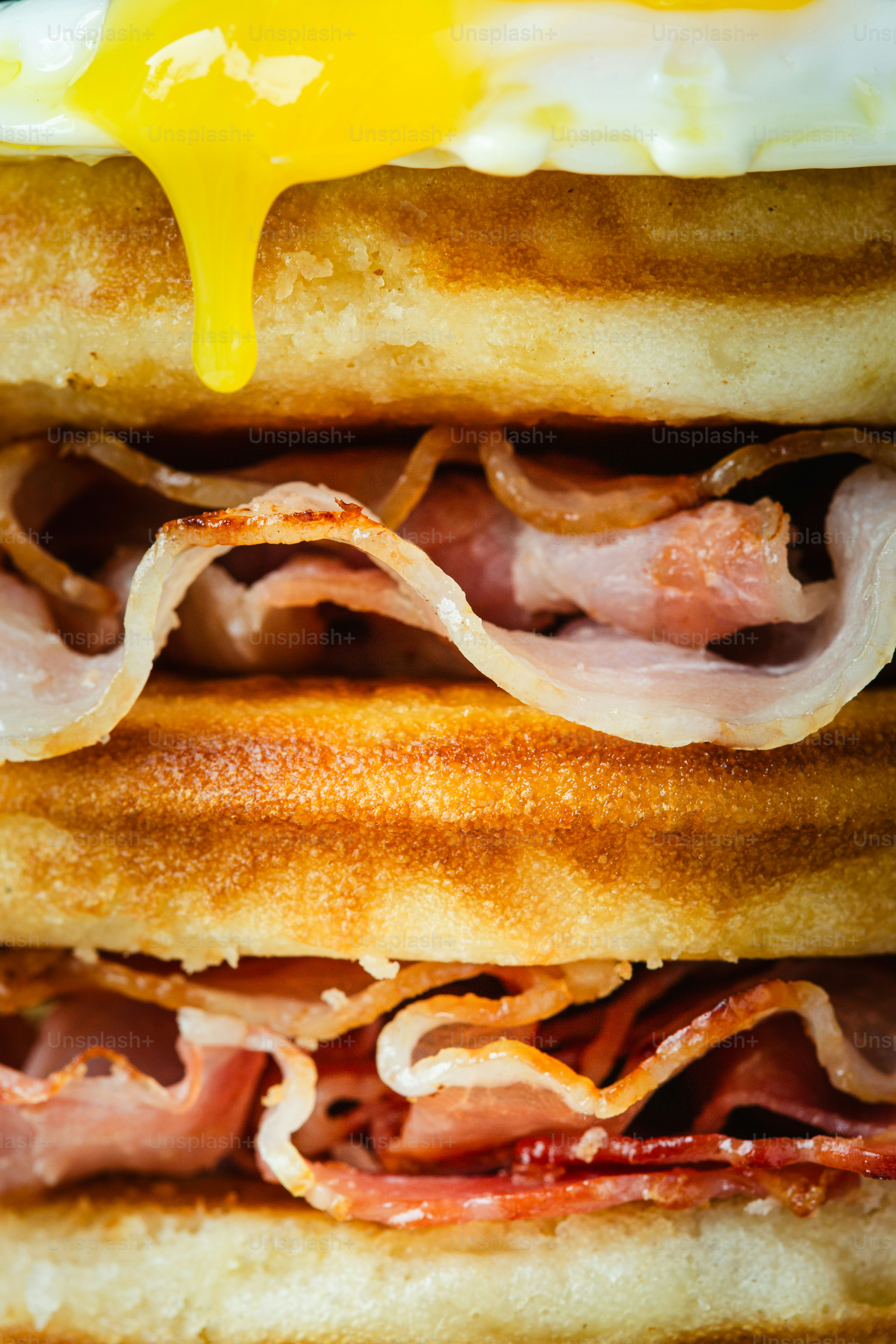 Waffle sandwich with bacon and fried egg